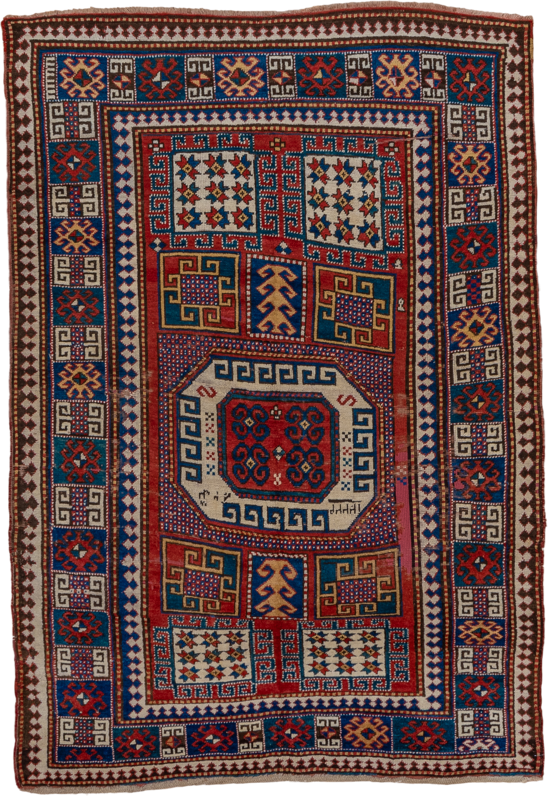 5' x 7' one-of-a-kind handmade vintage Kazak rug. Color palette: red, ivory, blue, navy, brown, rust, gold, terracotta