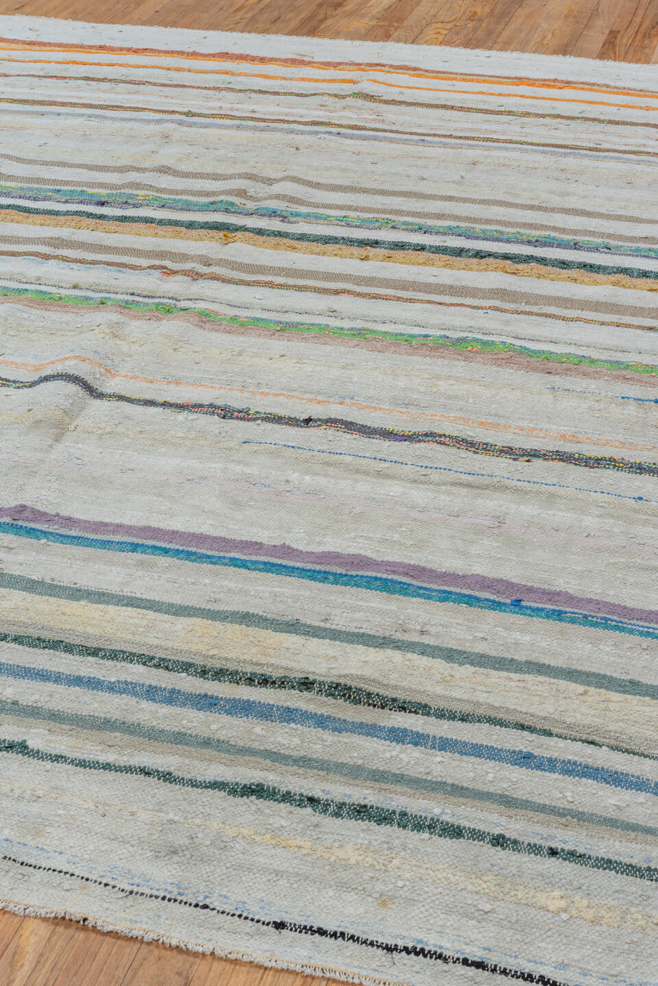 6' x 8' one-of-a-kind handmade antique Rag Rug medium size rug. Color palette: ivory, light blue, taupe, charcoal, saffron