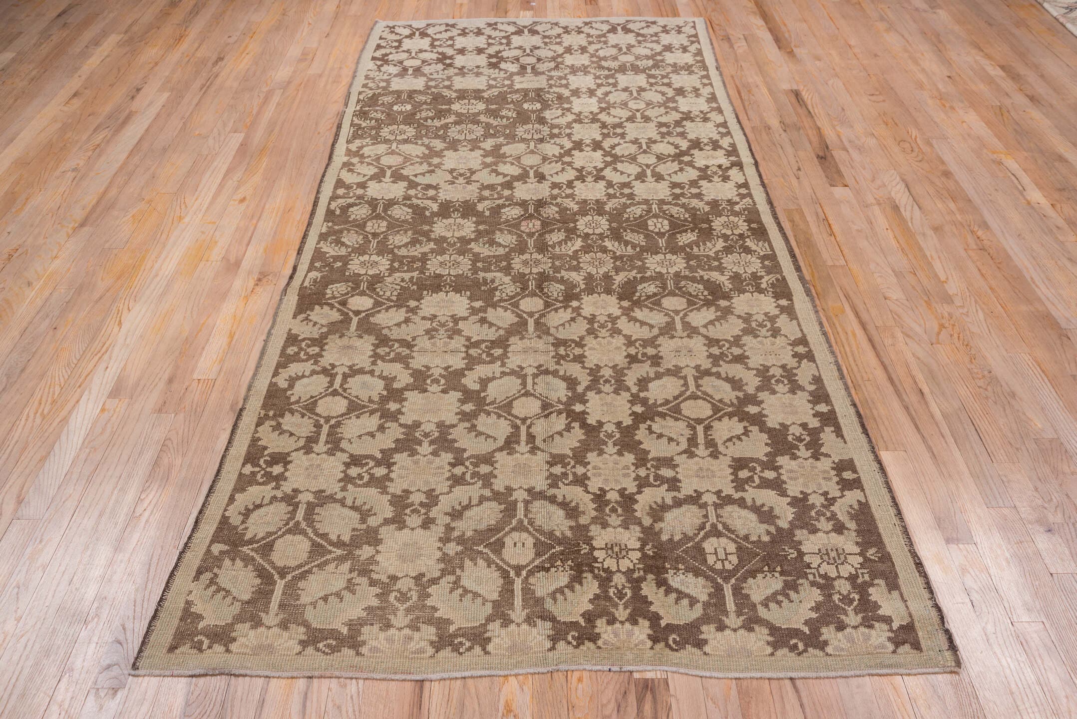 4' x 10' one-of-a-kind handmade vintage Oushak runner rug. Color palette: taupe, brown, beige, camel, ivory, gray
