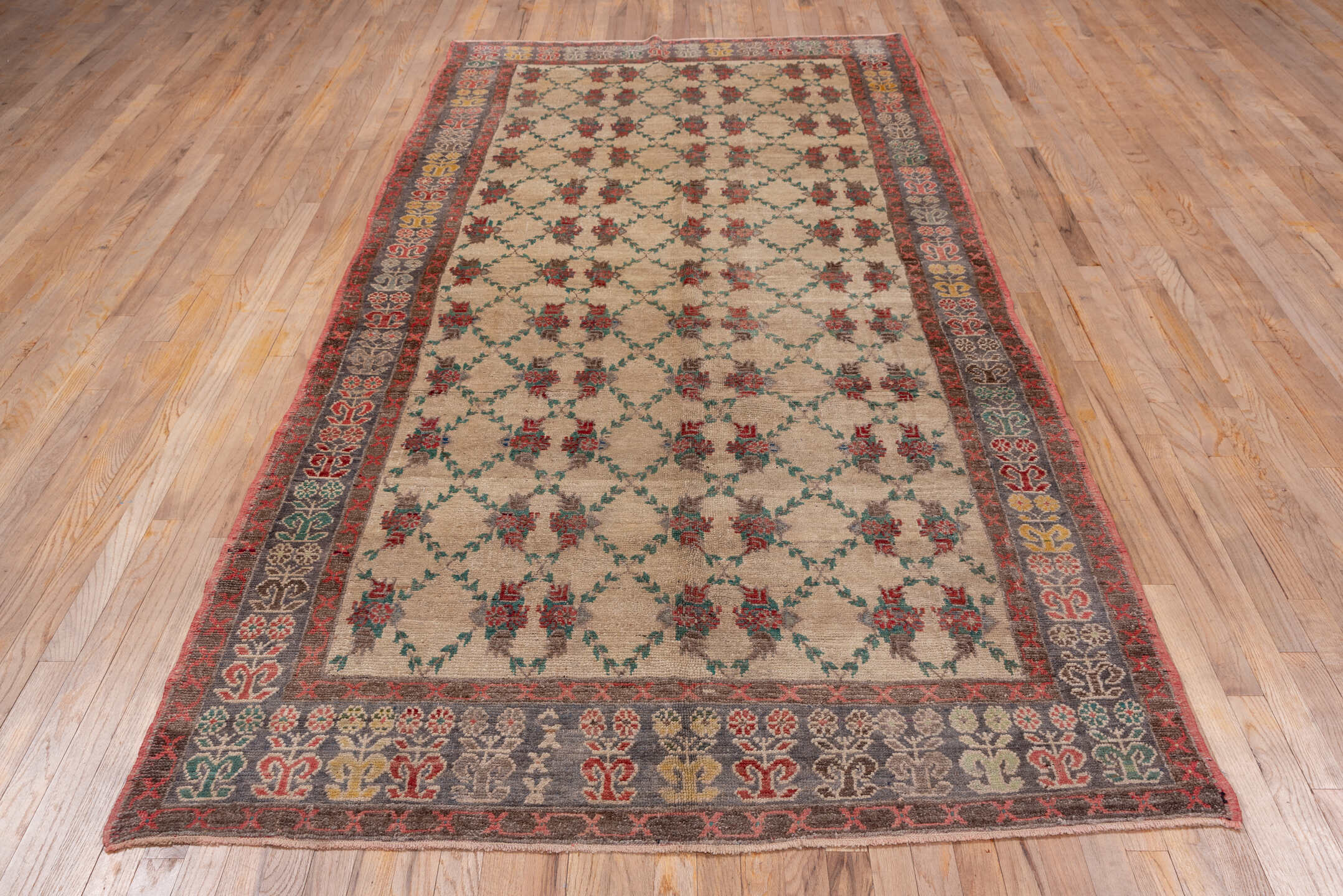 5' x 10' one-of-a-kind handmade vintage Konya rug. Color palette: ivory, charcoal, rust, teal, taupe, gold, crimson, gray