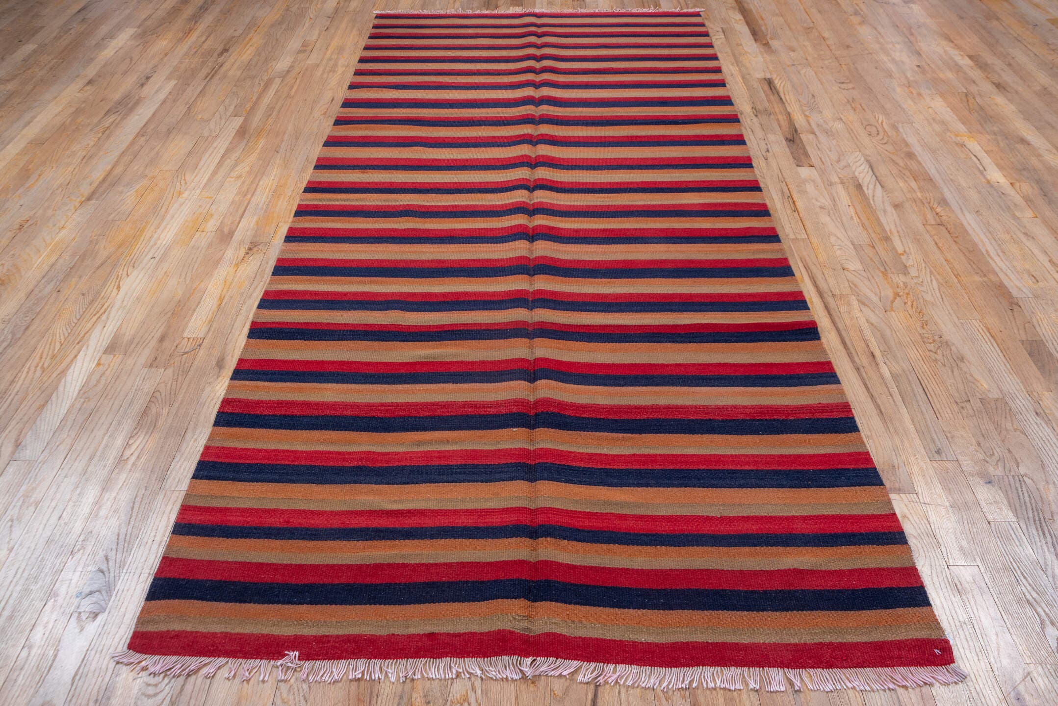 4' x 10' one-of-a-kind handmade vintage Kilim runner rug. Color palette: camel, navy, rust, red, tan, beige, blue