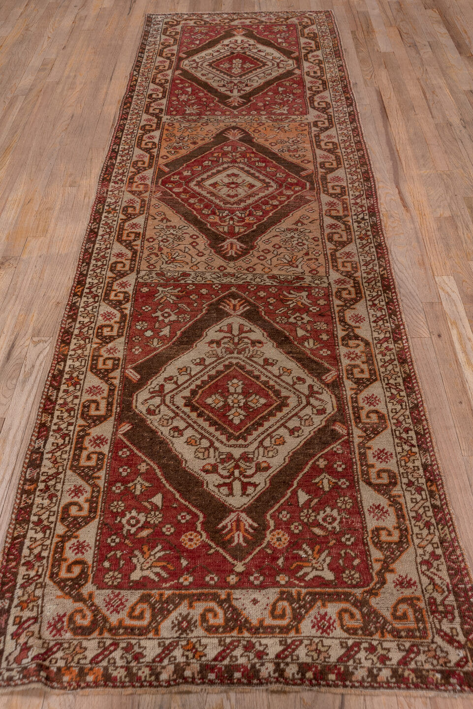3' x 11' one-of-a-kind handmade vintage Sivas runner rug. Color palette: rust, ivory, terra cotta, brown, burgundy, camel