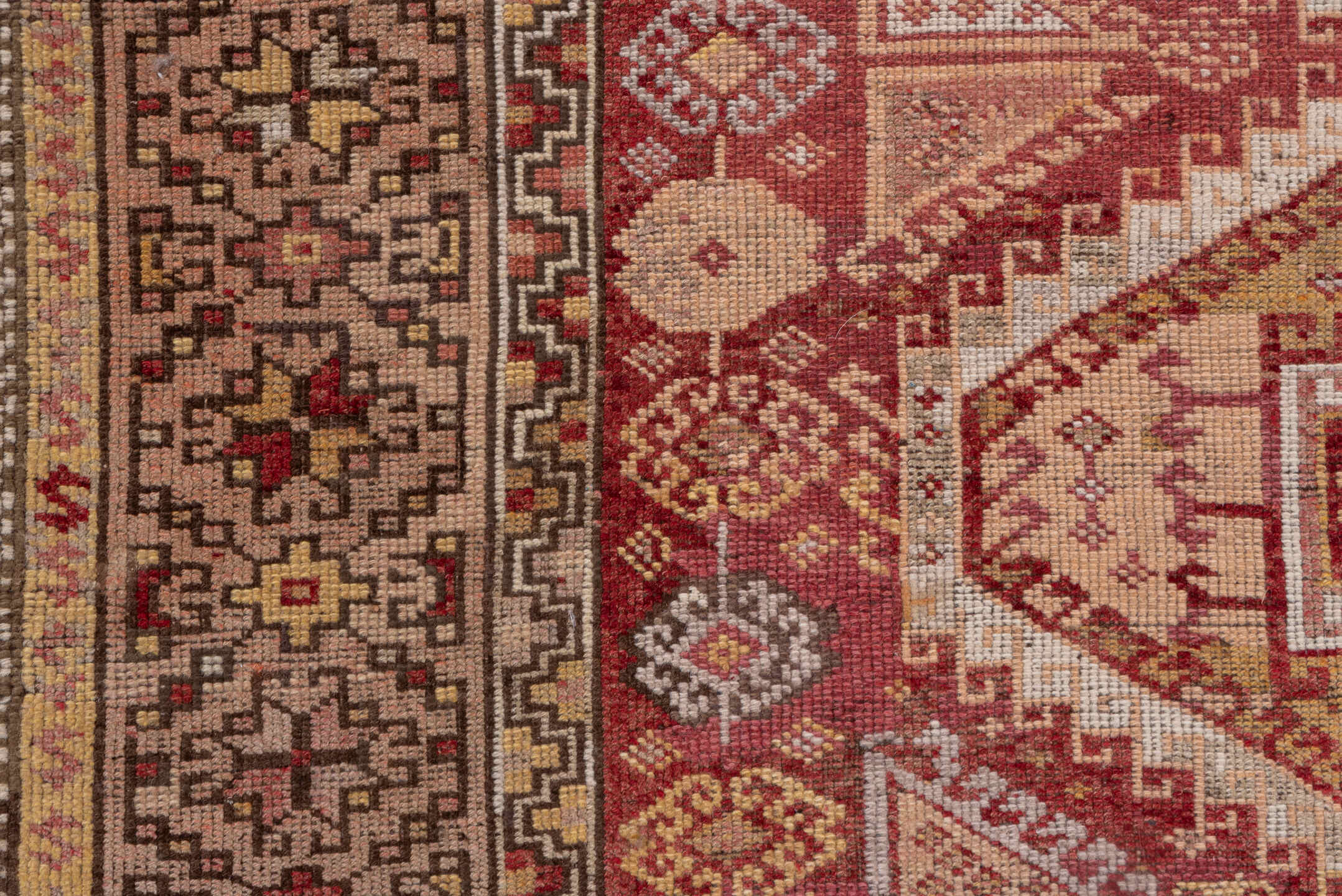 4' x 11' one-of-a-kind handmade vintage Kurd runner rug. Color palette: brown, pink, red