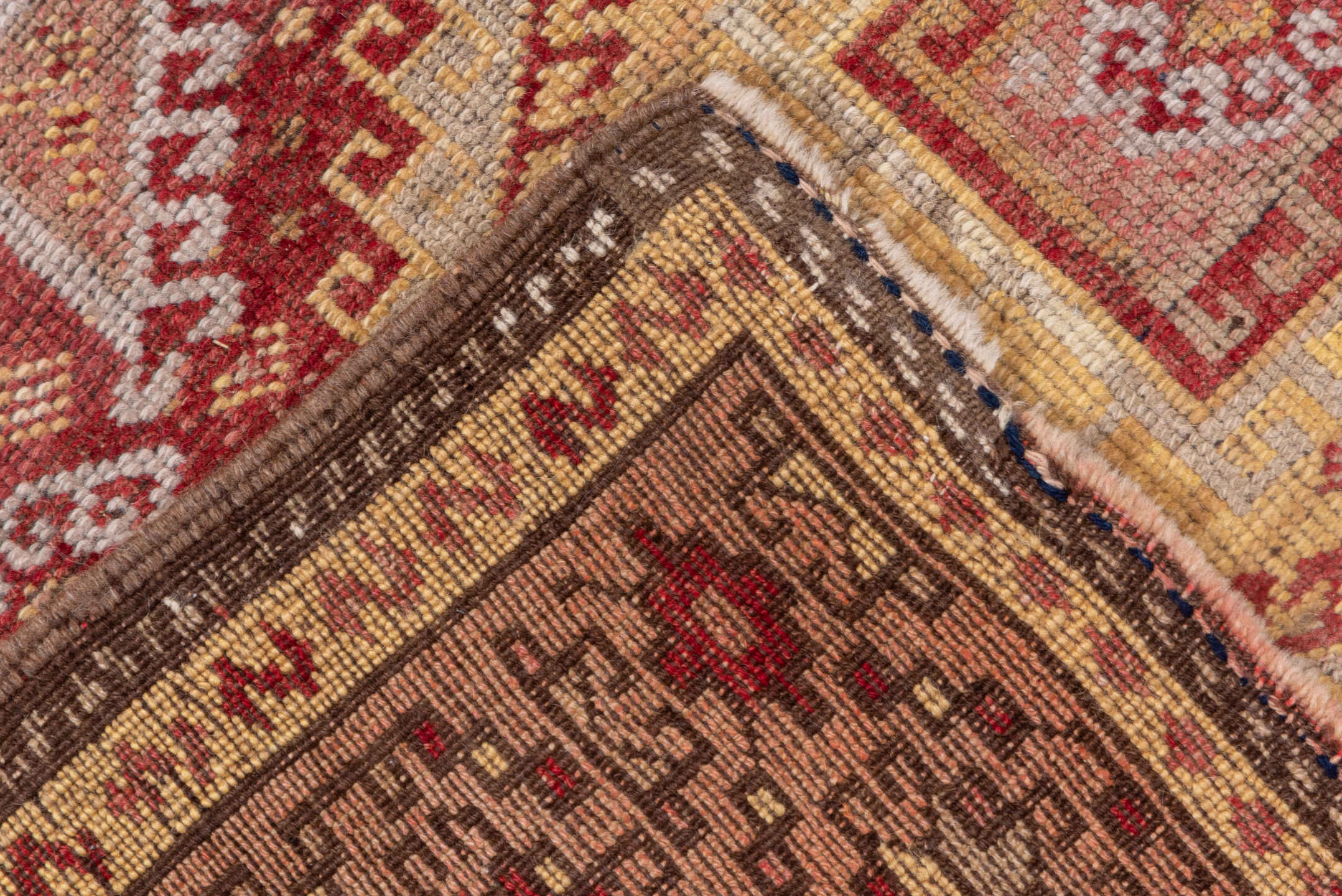 4' x 11' one-of-a-kind handmade vintage Kurd runner rug. Color palette: brown, pink, red