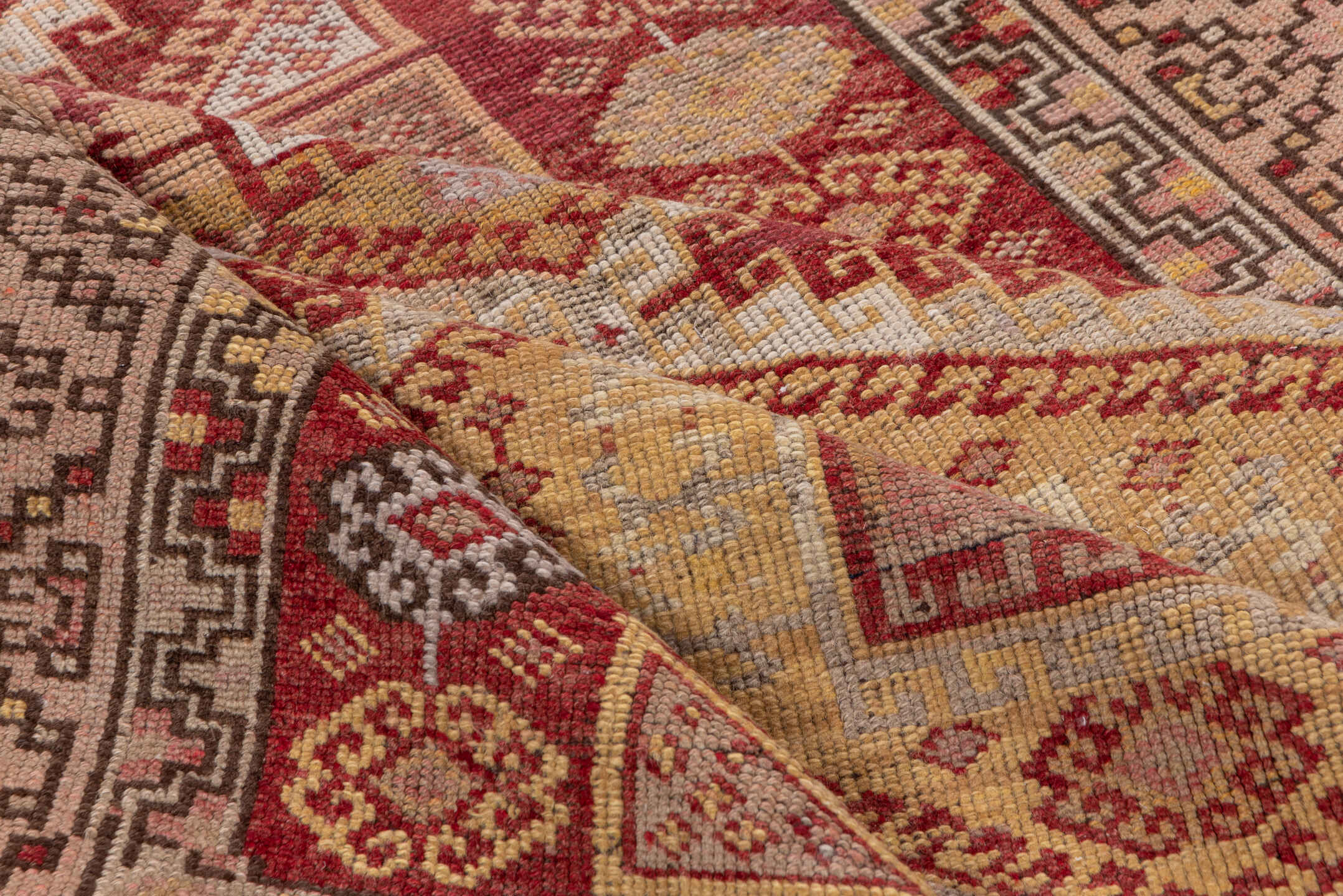 4' x 11' one-of-a-kind handmade vintage Kurd runner rug. Color palette: brown, pink, red