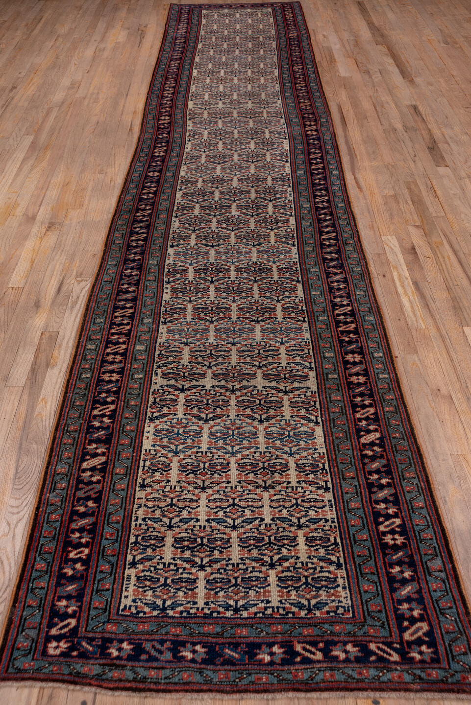 3' x 16' one-of-a-kind handmade vintage NW Persian runner rug. Color palette: ivory, navy, rust, slate, rose, camel, blue