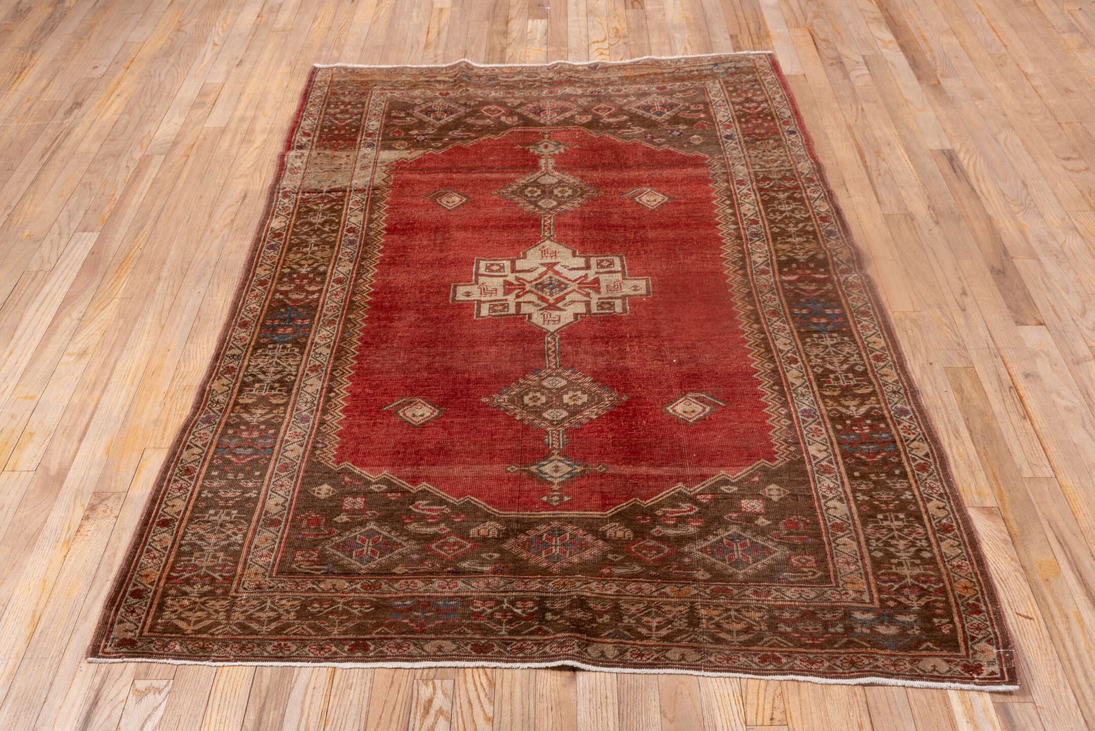 4' x 6' one-of-a-kind handmade vintage Oushak small size rug. Color palette: rust, brown, ivory, terra cotta, camel, blue