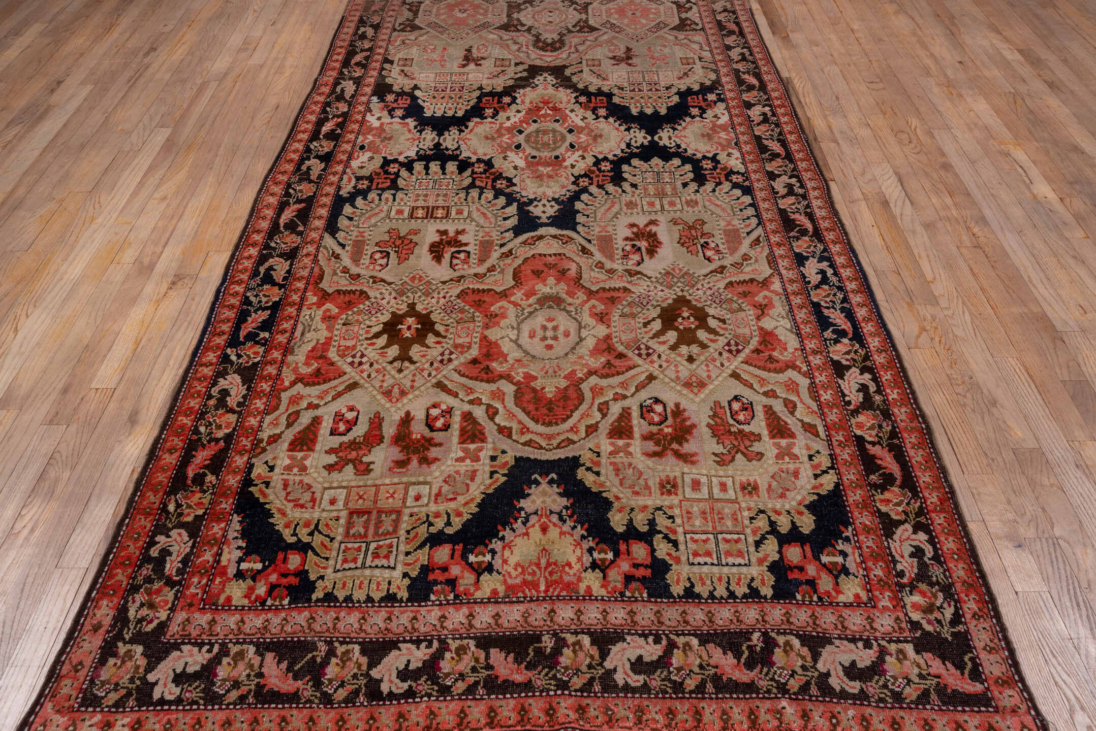 5' x 12' one-of-a-kind handmade antique Karabagh rug. Color palette: ivory, navy, rose, rust, charcoal, taupe, coral, blue