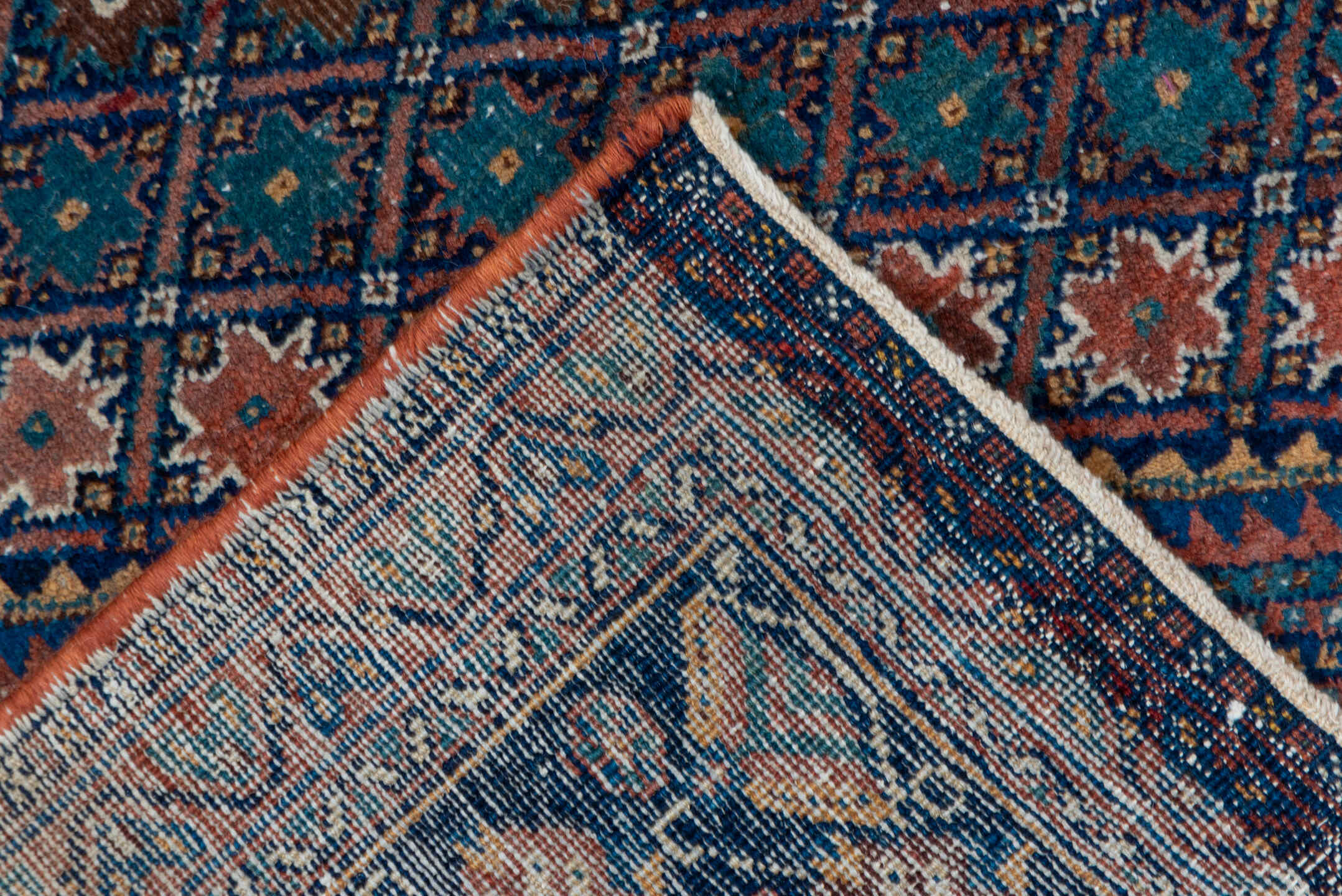 5' x 7' one-of-a-kind handmade antique Afshar rug. Color palette: navy, rust, camel, teal, ivory, rose, brown, blue