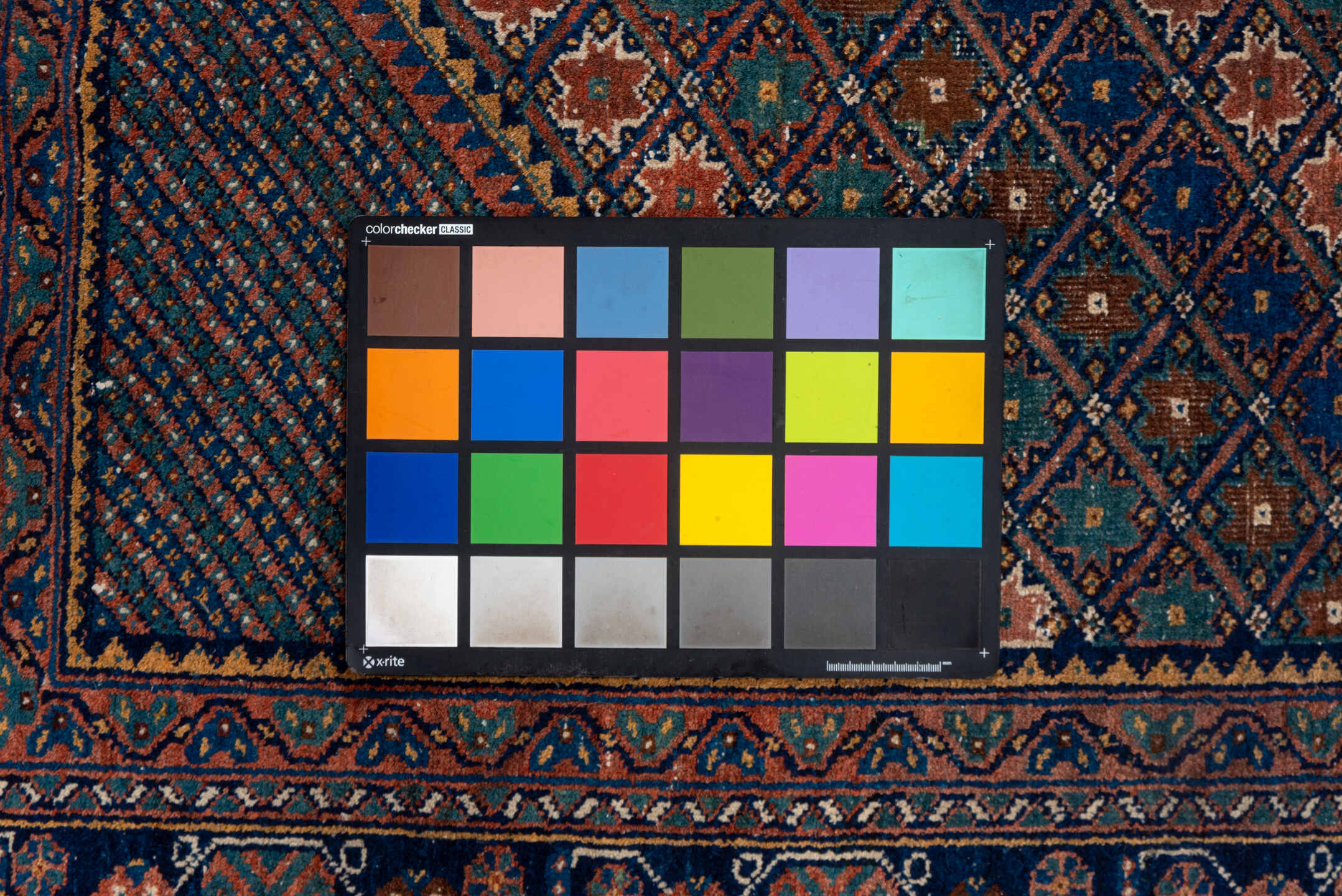 5' x 7' one-of-a-kind handmade antique Afshar rug. Color palette: navy, rust, camel, teal, ivory, rose, brown, blue