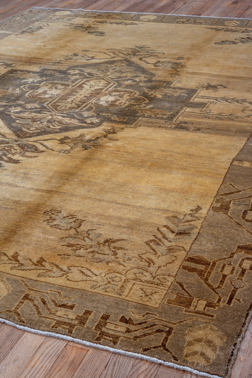 7' x 10' one-of-a-kind handmade vintage Oushak large size rug. Color palette: camel, taupe, brown, ivory, beige, gray