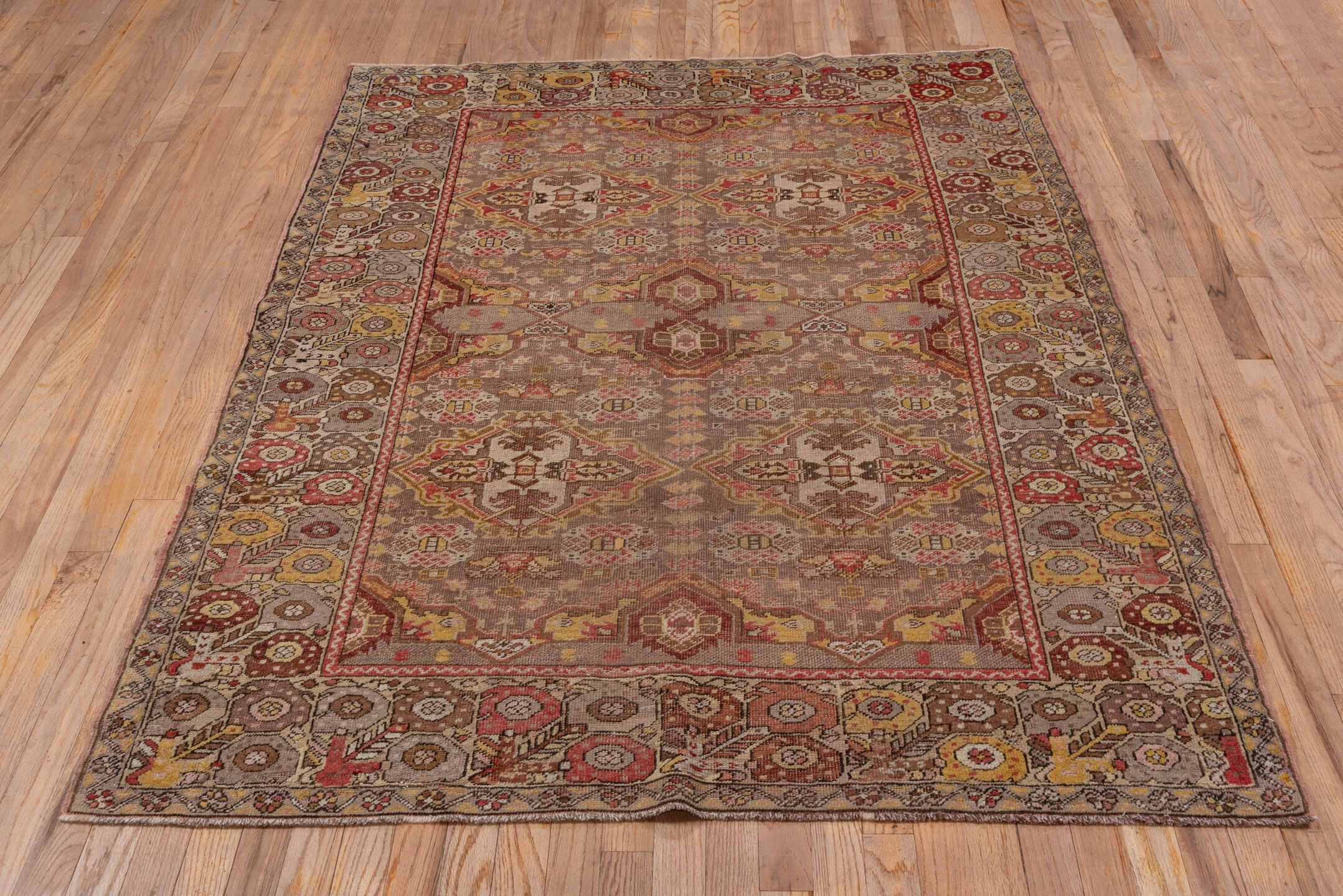 4' x 6' one-of-a-kind handmade vintage Oushak small size rug. Color palette: brown, gray, light gray, off-white, pink, red
