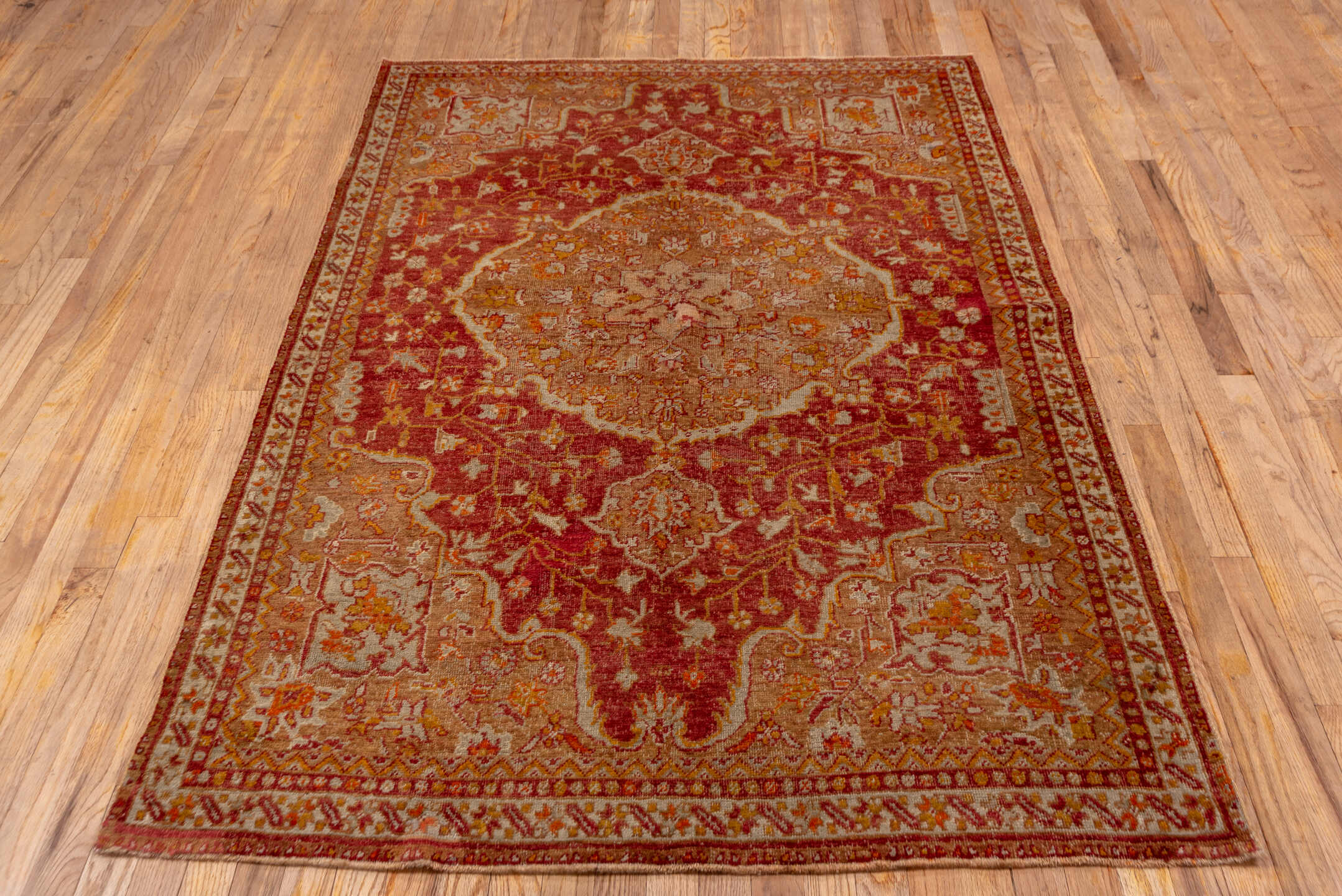 4' x 7' one-of-a-kind handmade vintage Sivas rug. Color palette: rust, terra cotta, rose, ivory, gold, camel, sienna