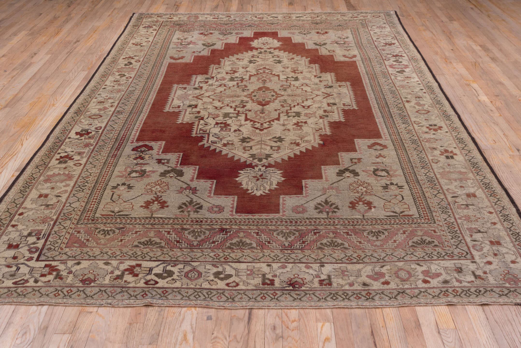 7' x 12' one-of-a-kind handmade vintage Oushak large size rug. Color palette: terra cotta, ivory, rose, taupe, sage