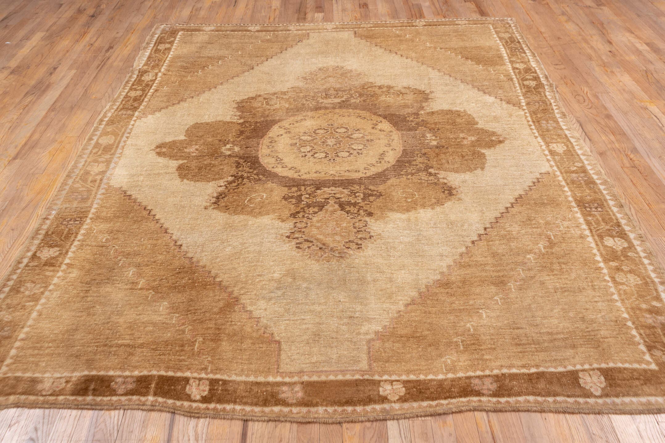 7' x 9' one-of-a-kind handmade vintage Oushak rug. Color palette: camel, ivory, taupe, beige, tan, brown, gray