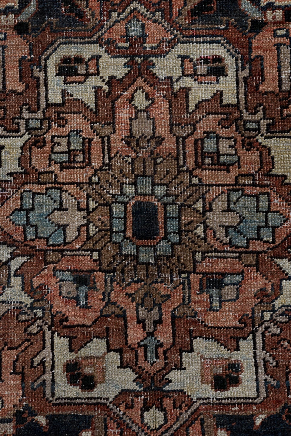 6' x 9' one-of-a-kind handmade antique Heriz medium size rug. Color palette: terra cotta, navy, ivory, slate, taupe, rust