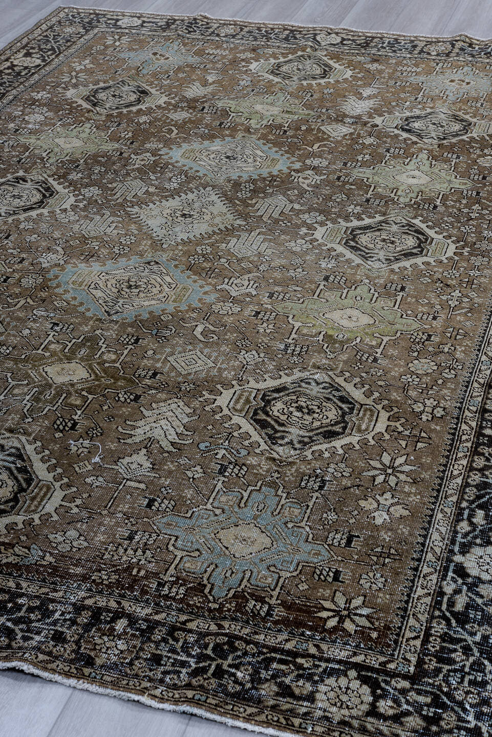 7' x 10' one-of-a-kind handmade antique Karaje large size rug. Color palette: brown, navy, ivory, taupe, sage, aqua