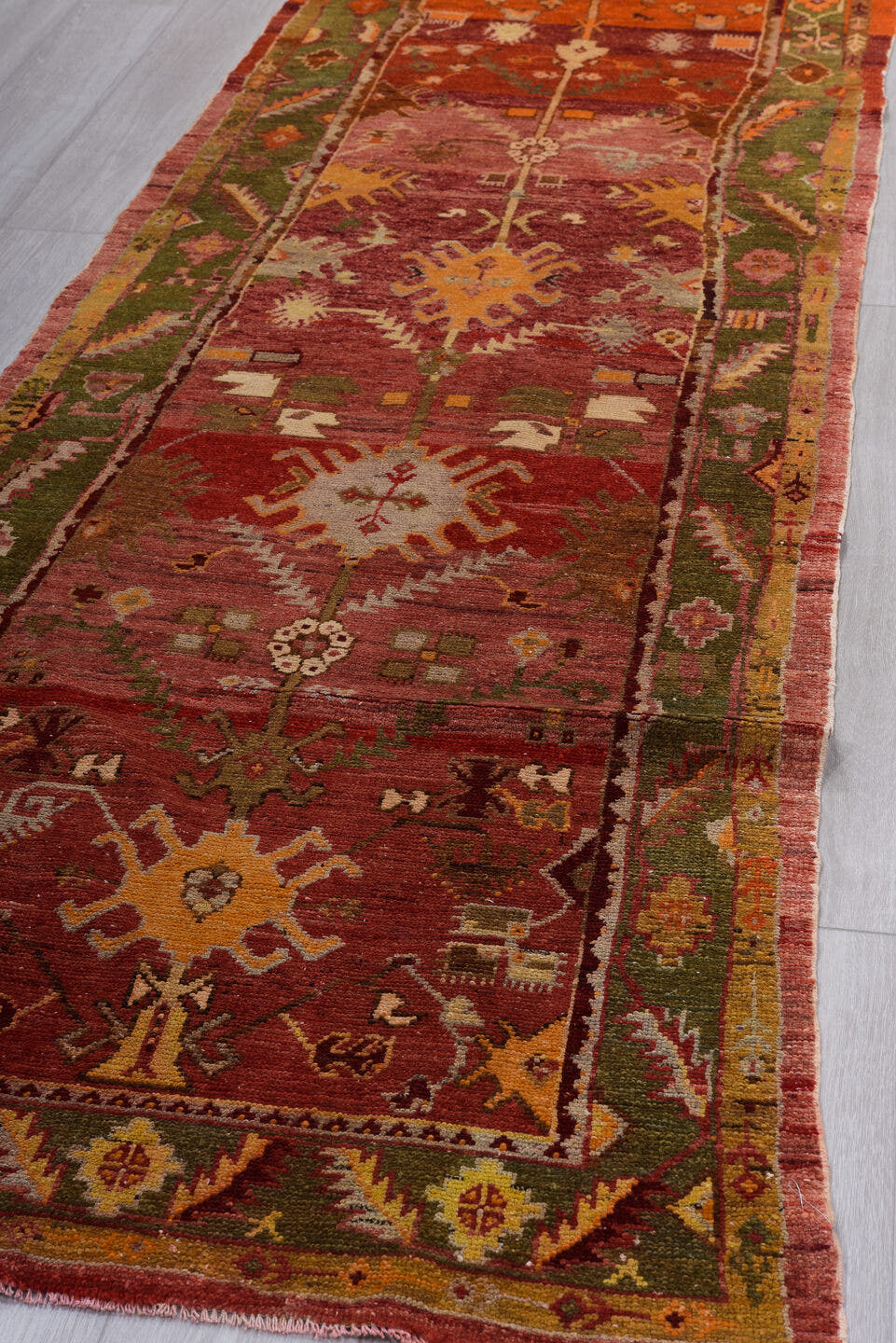 3' x 9' one-of-a-kind handmade vintage Oushak runner rug. Color palette: rust, crimson, olive, rose, gold, terra cotta