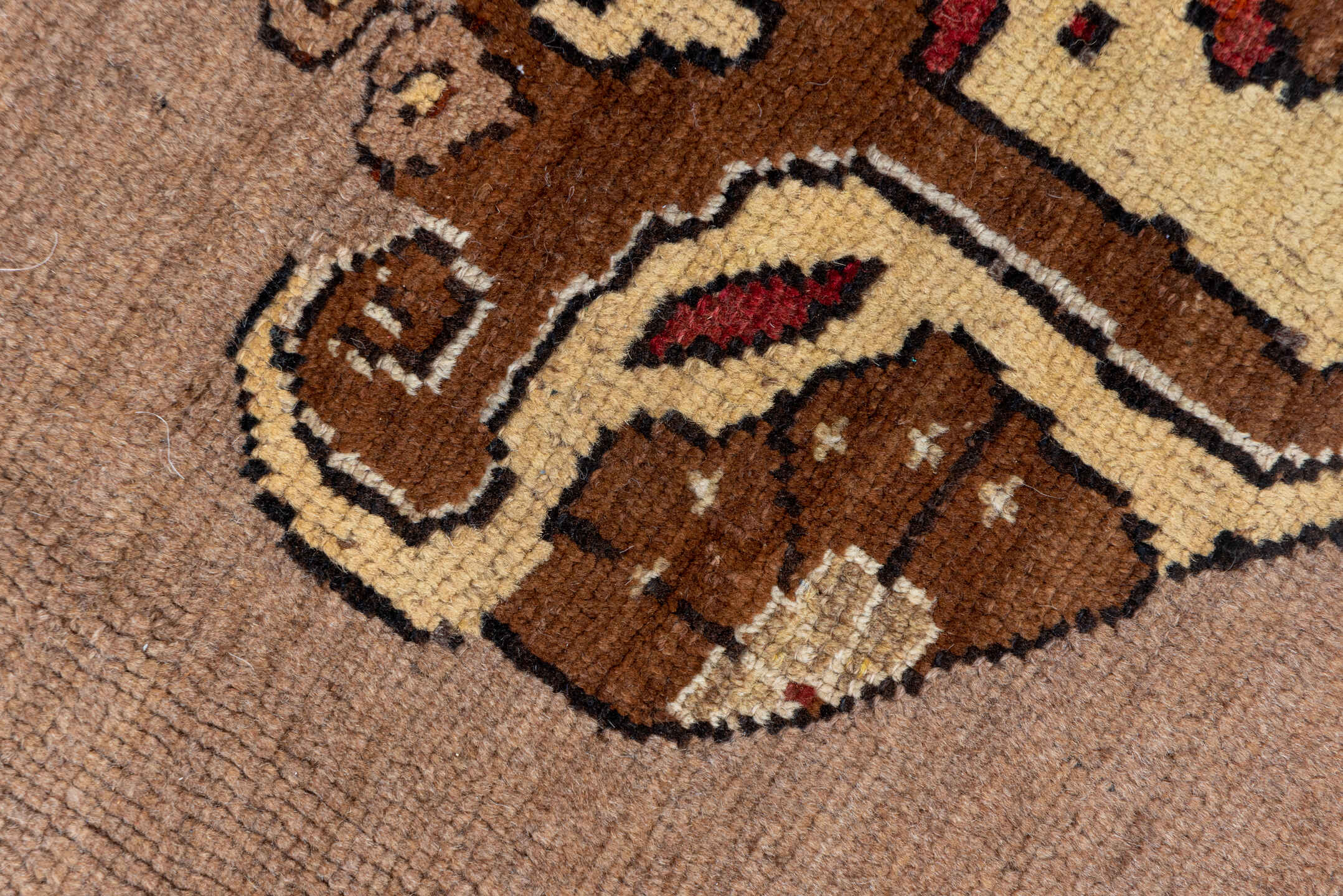 7' x 9' one-of-a-kind handmade vintage Kars rug. Color palette: taupe, brown, ivory, walnut, rust, charcoal, camel, burgundy