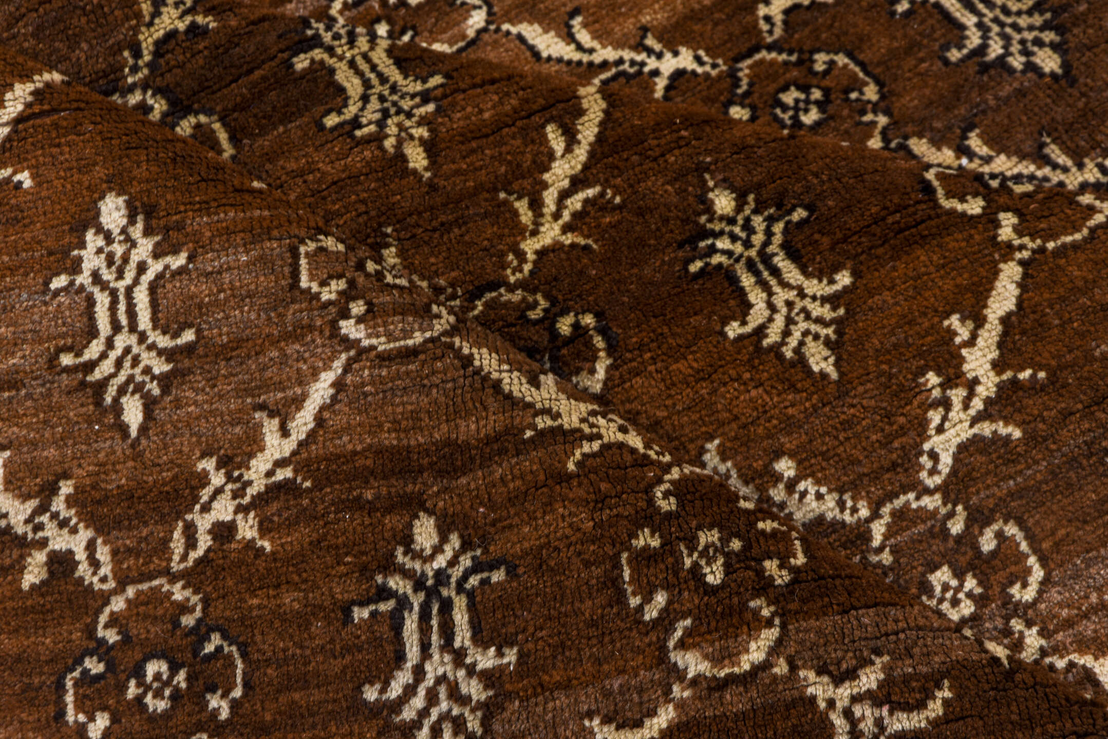 7' x 9' one-of-a-kind handmade vintage Kars rug. Color palette: brown, gray, light gray, off-white, pink