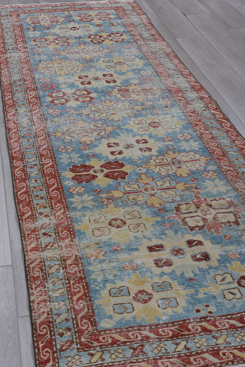 3' x 10' one-of-a-kind handmade antique Heriz runner rug. Color palette: sky blue, rust, ivory, brick, pale blue, cream