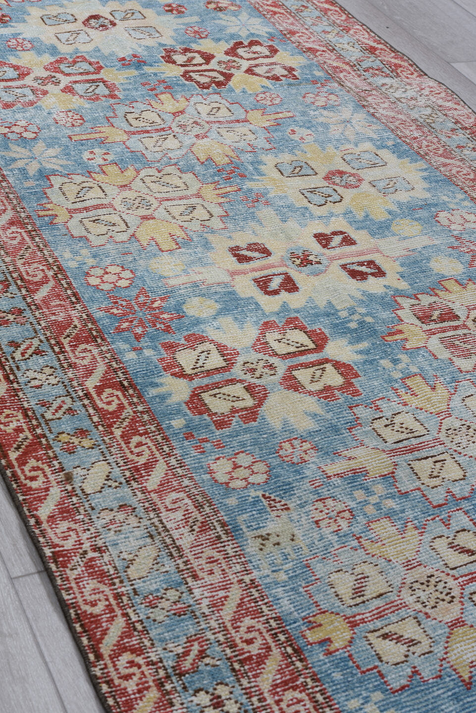 3' x 10' one-of-a-kind handmade antique Heriz runner rug. Color palette: sky blue, rust, ivory, brick, pale blue, cream