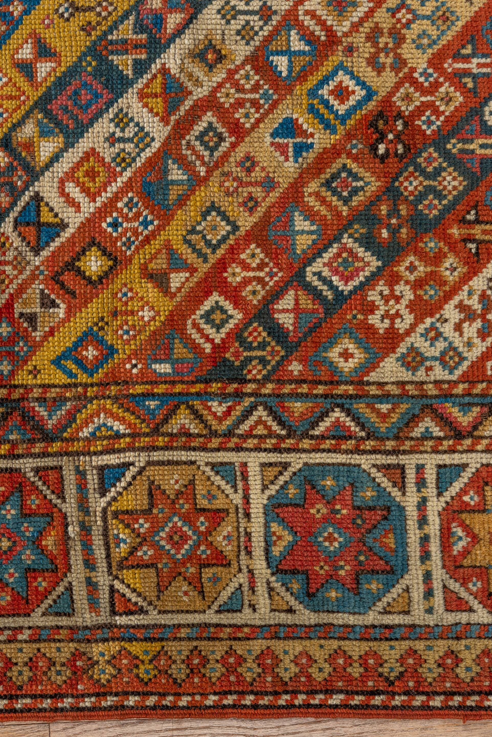 3' x 4' one-of-a-kind handmade antique Kazak small size rug. Color palette: ivory, rust, sky_blue, gold, navy, terra_cotta