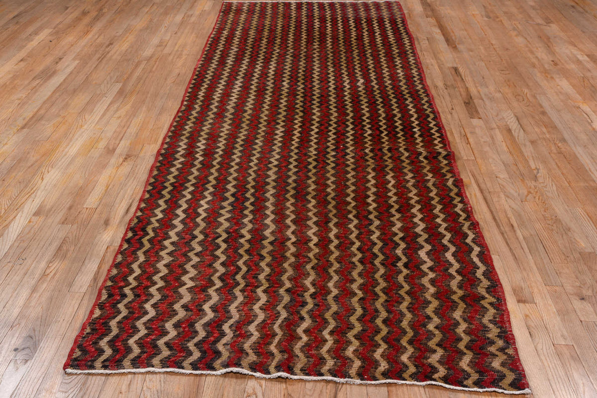 4' x 12' one-of-a-kind handmade vintage Tulu runner rug. Color palette: brown, red, taupe, charcoal, beige, gray, black