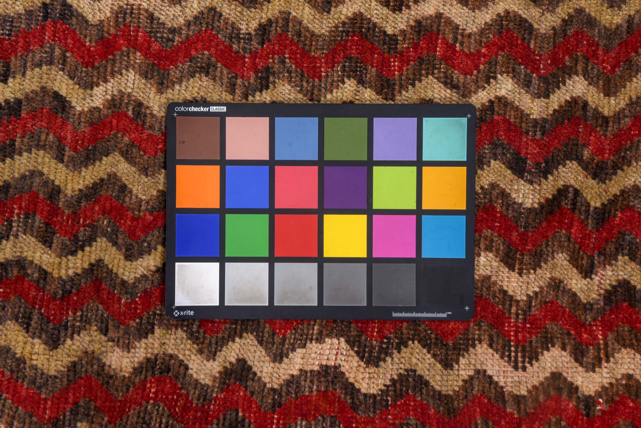 4' x 12' one-of-a-kind handmade vintage Tulu runner rug. Color palette: brown, red, taupe, charcoal, beige, gray, black