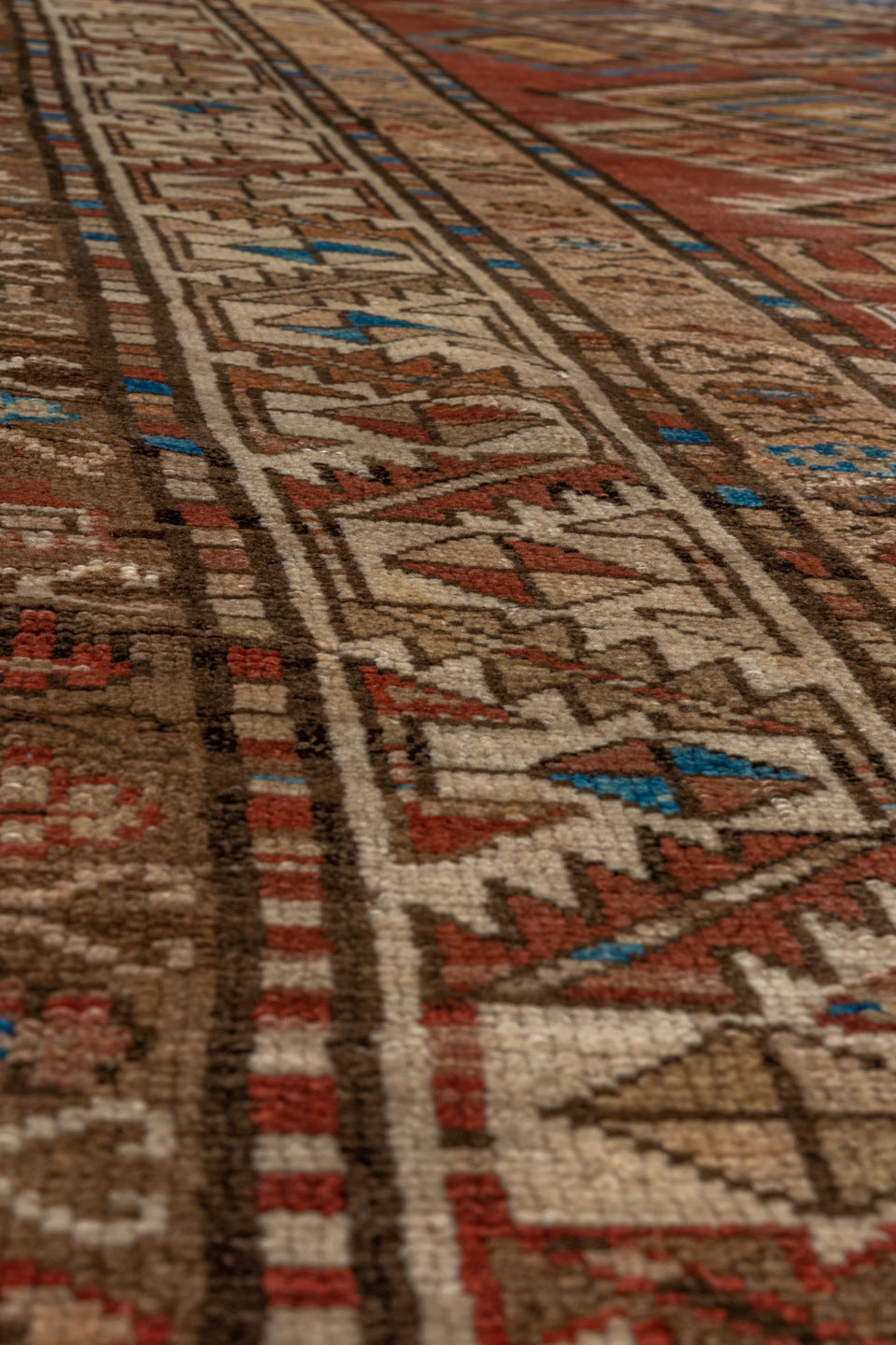 4' x 9' one-of-a-kind handmade vintage Kurd runner rug. Color palette: arapawa, blue, brown, gray, light gray, pink