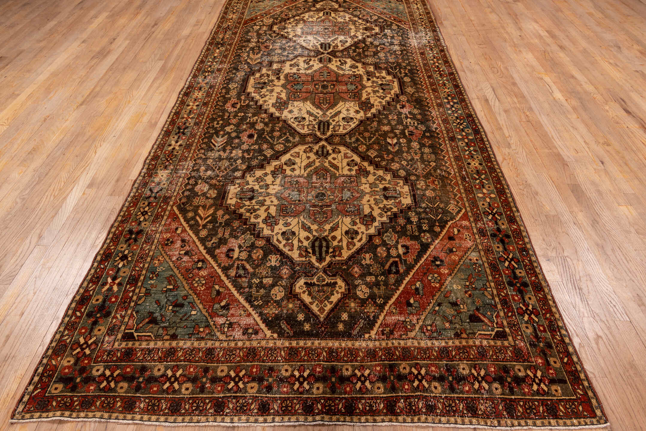 5' x 12' one-of-a-kind handmade vintage Baktiary rug. Color palette: brown, red