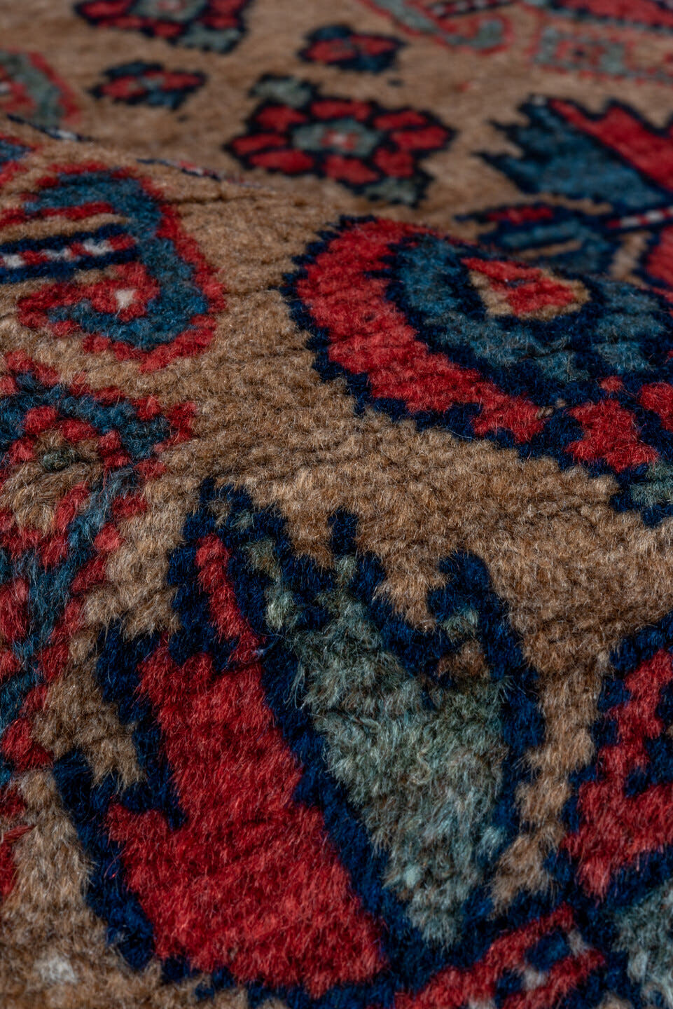 3' x 5' one-of-a-kind handmade vintage Kurd small size rug. Color palette: rust, camel, indigo, ivory, crimson, charcoal