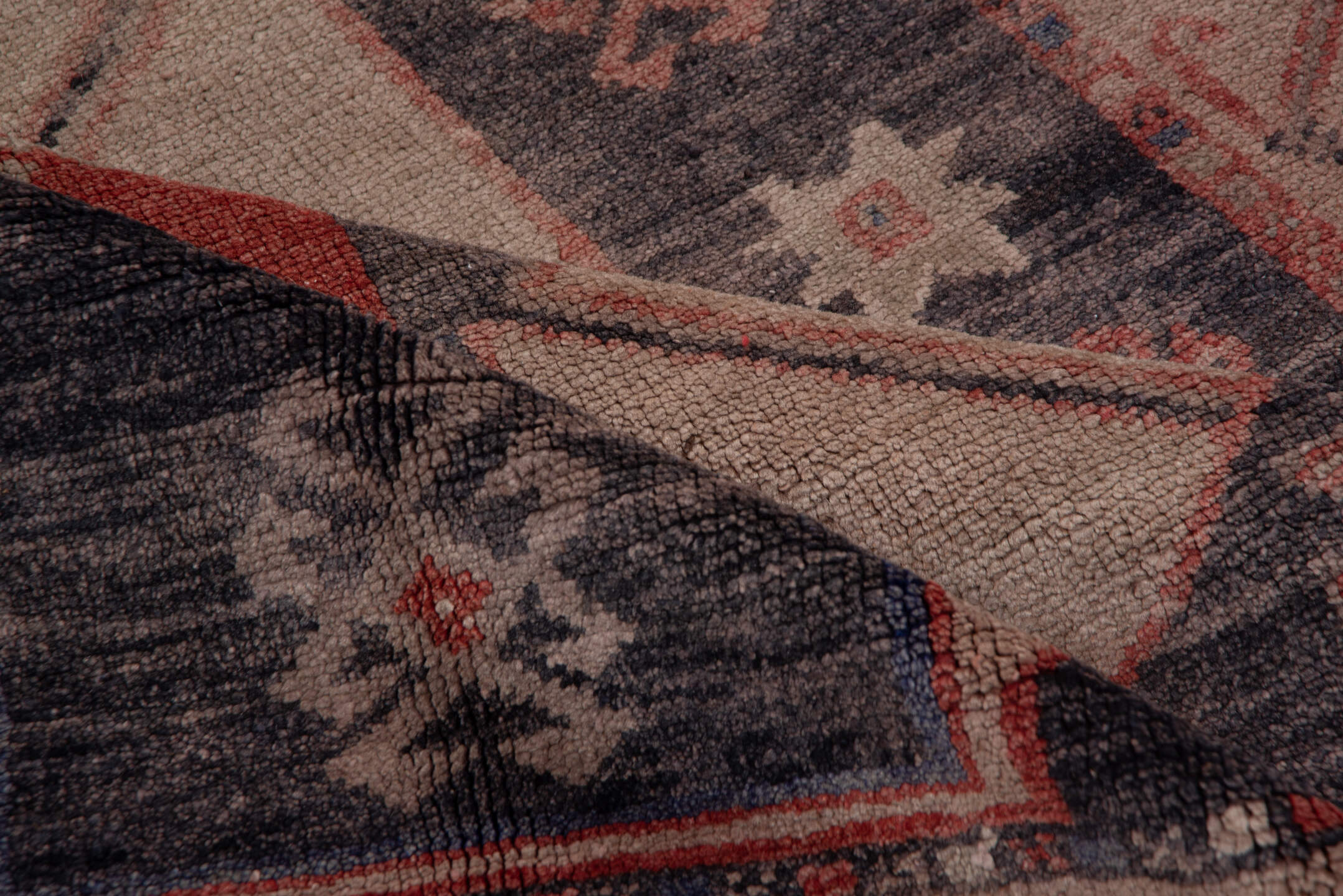 4' x 9' one-of-a-kind handmade vintage Oushak runner rug. Color palette: black, brown, charcoal, gray, pink, red, redwood