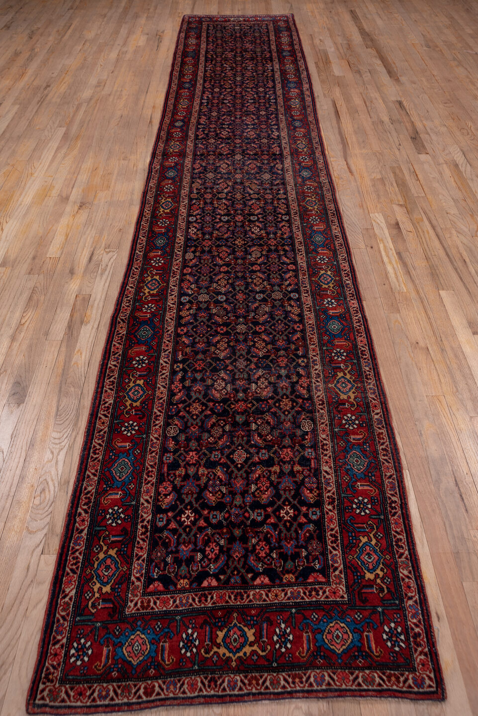 3' x 16' one-of-a-kind handmade vintage Bidjar runner rug. Color palette: blue, brown, gray, off-white, pink, red, redwood