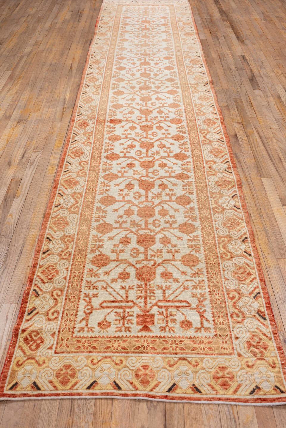 3' x 16' one-of-a-kind handmade vintage Khotan runner rug. Color palette: ivory, rust, peach, terra cotta, camel, terracotta