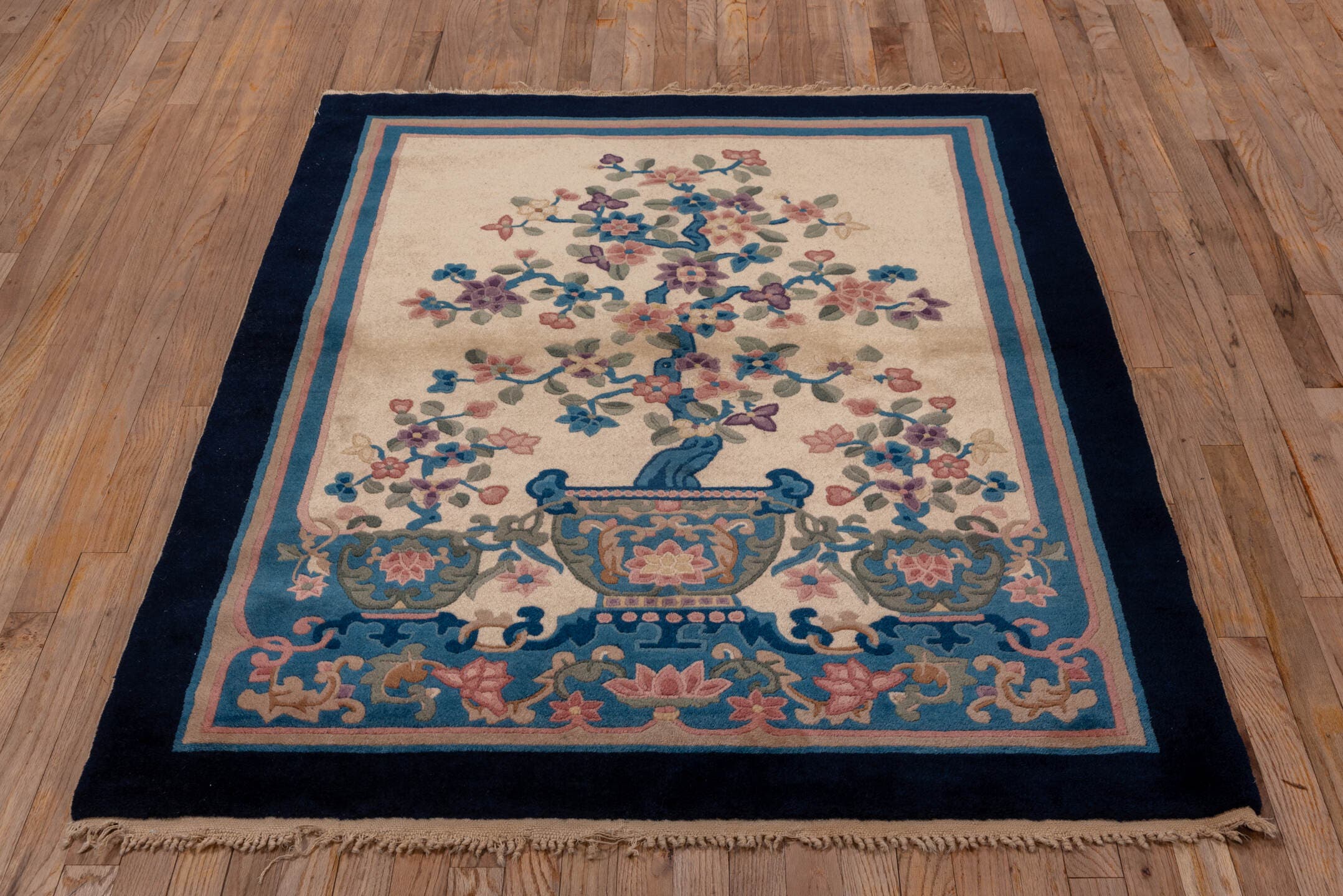 4' x 5' one-of-a-kind handmade vintage Chinese small size rug. Color palette: ivory, navy, blue, rose, sage, lavender, taupe