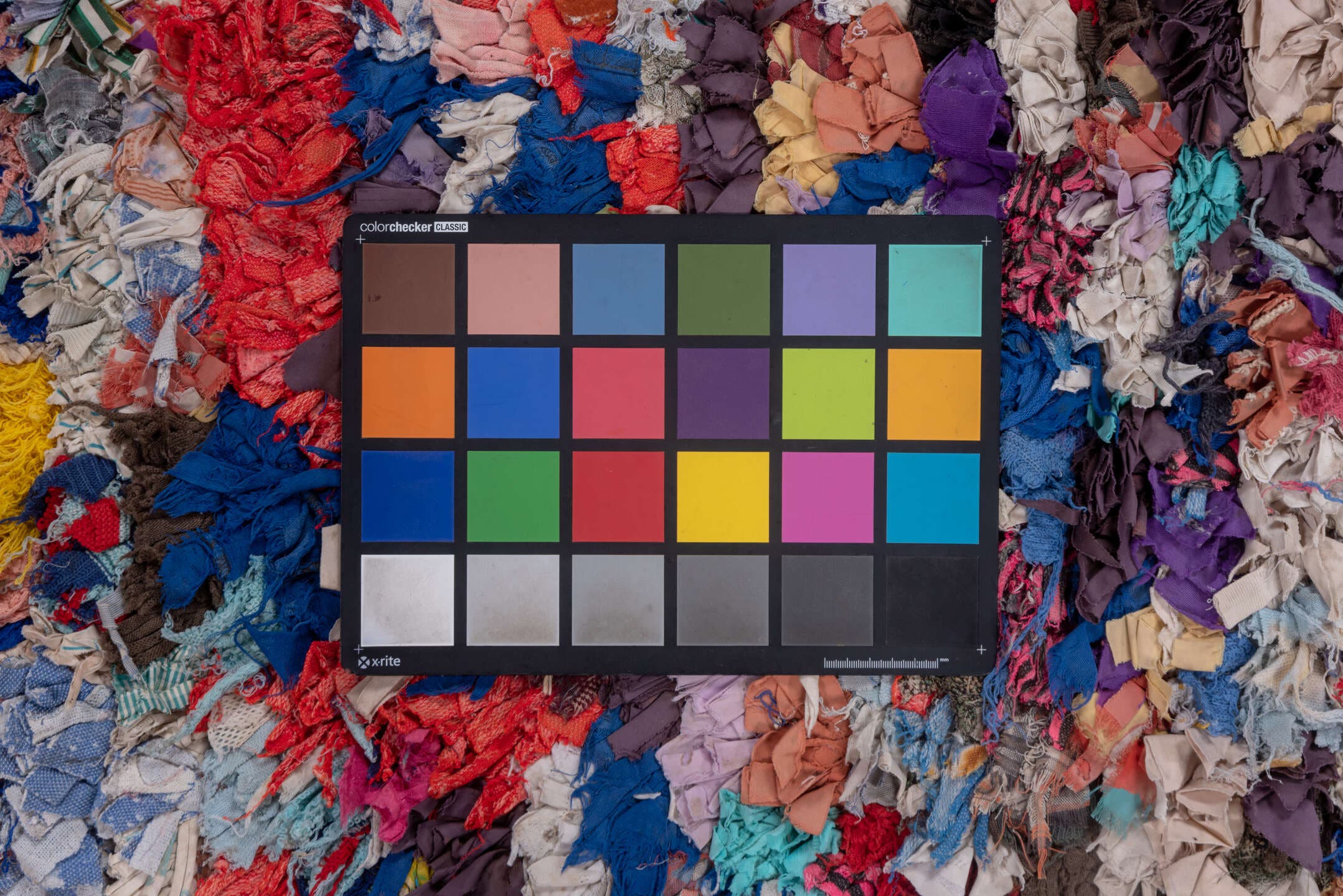 4' x 7' one-of-a-kind handmade vintage Rag Rug rug. Color palette: ivory, gray, blue, pink, purple, red, yellow, charcoal