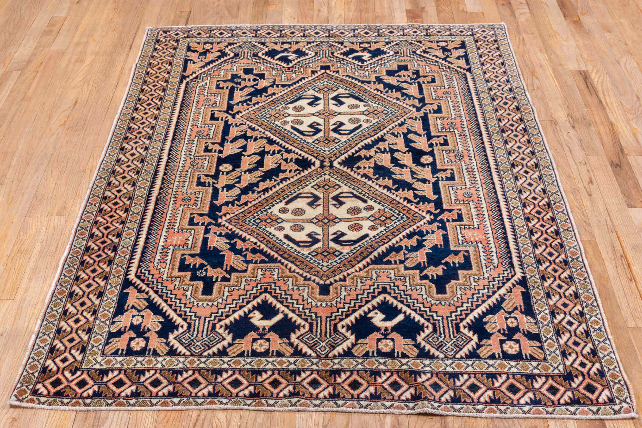 4' x 5' one-of-a-kind handmade antique Afshar small size rug. Color palette: navy, ivory, blush, taupe, rose, camel, blue