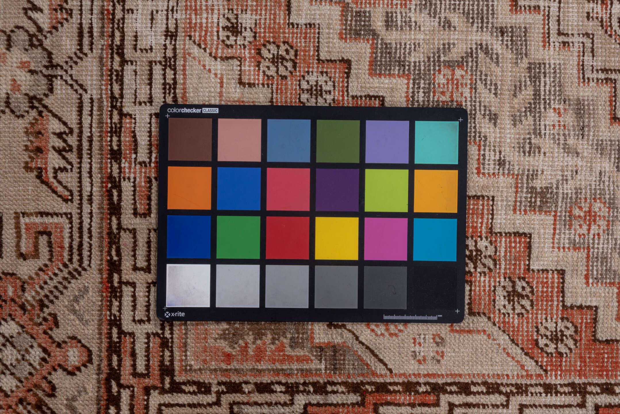 5' x 9' one-of-a-kind handmade vintage Khotan medium size rug. Color palette: brown, gray, light gray, off-white, pink