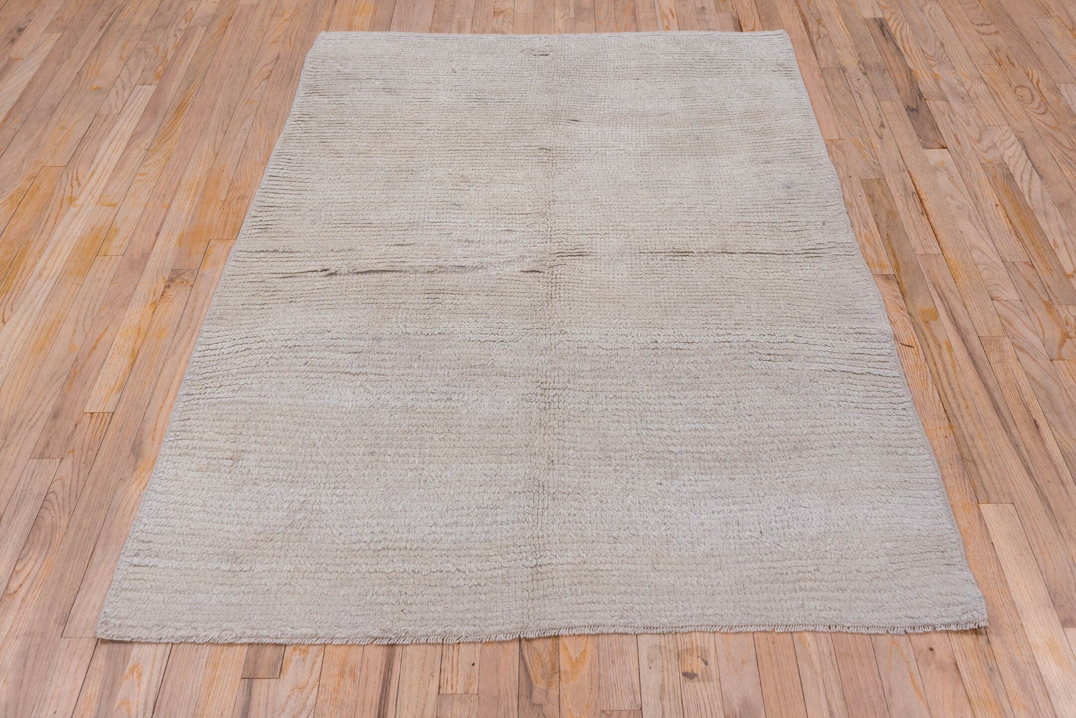 4' x 6' one-of-a-kind handmade antique Tulu small size rug. Color palette: ivory, cream, taupe, beige, gray