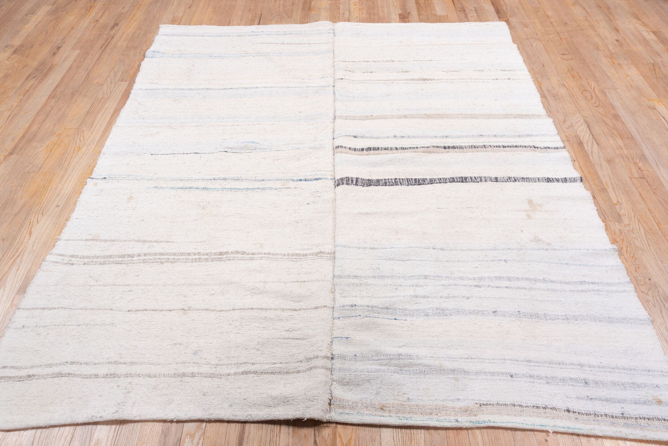 6' x 7' one-of-a-kind handmade antique Rag Rug rug. Color palette: ivory, cream, charcoal, slate, faded blue, taupe, gray