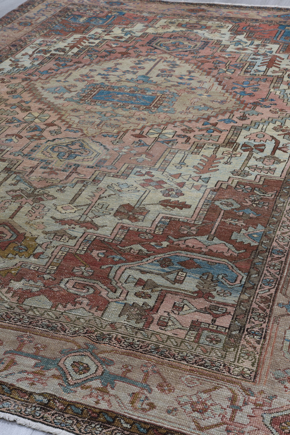 8' x 12' one-of-a-kind handmade antique Serapi large size rug. Color palette: ivory, rust, sky blue, taupe, brown, slate