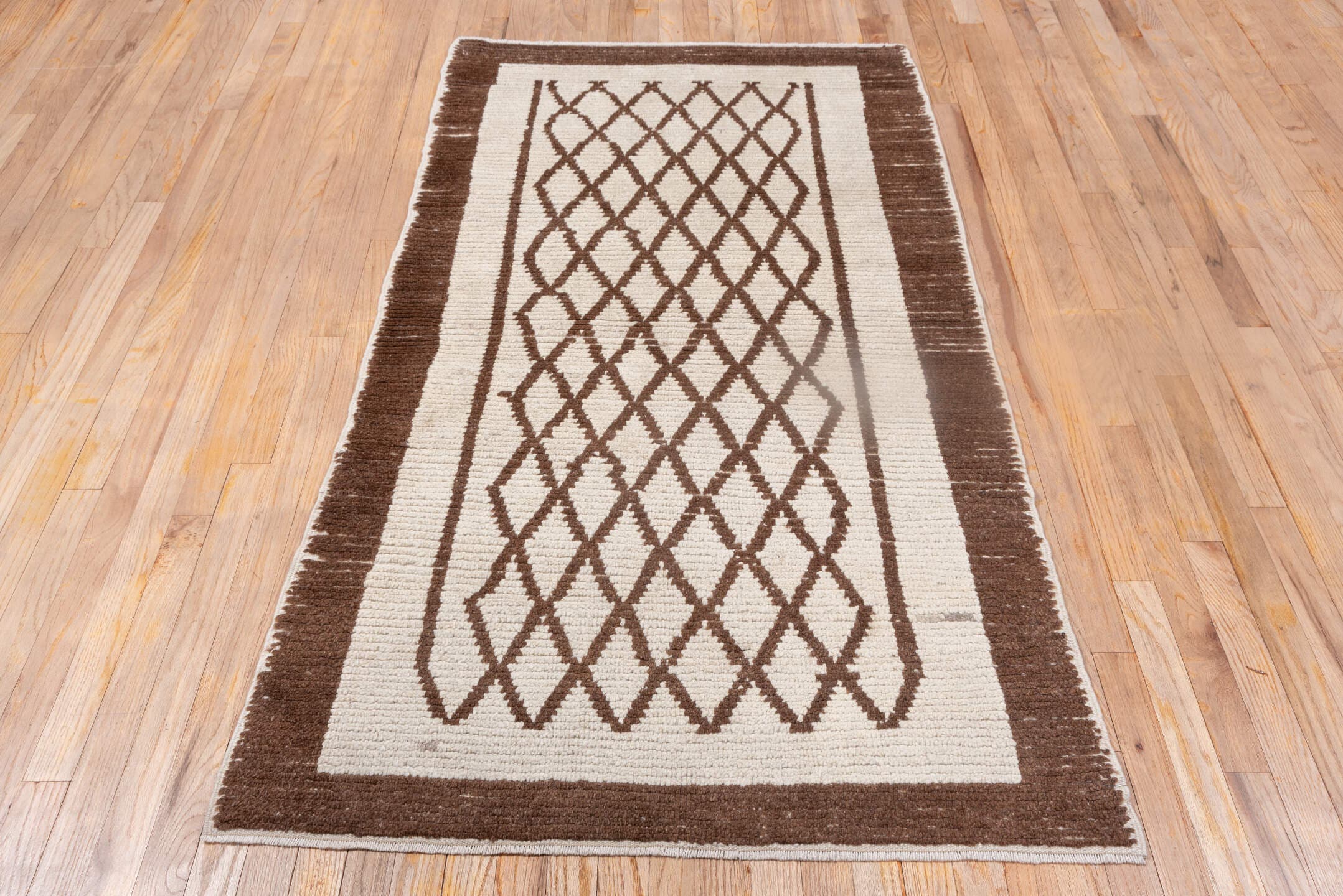 3' x 6' one-of-a-kind handmade vintage Tulu small size rug. Color palette: ivory, brown