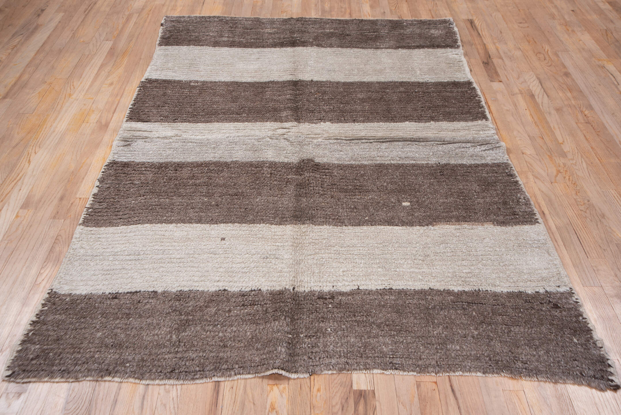 5' x 7' one-of-a-kind handmade antique Moroccan rug. Color palette: taupe, ivory, cream, greige, stone, beige, gray