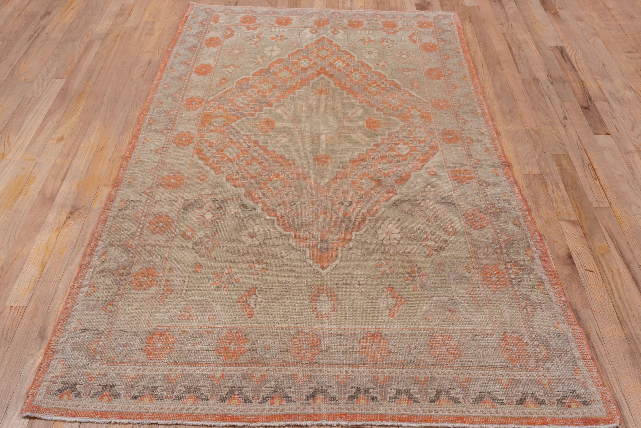 4' x 7' one-of-a-kind handmade antique Khotan rug. Color palette: taupe, coral, ivory, pewter, rose, camel, beige, gray