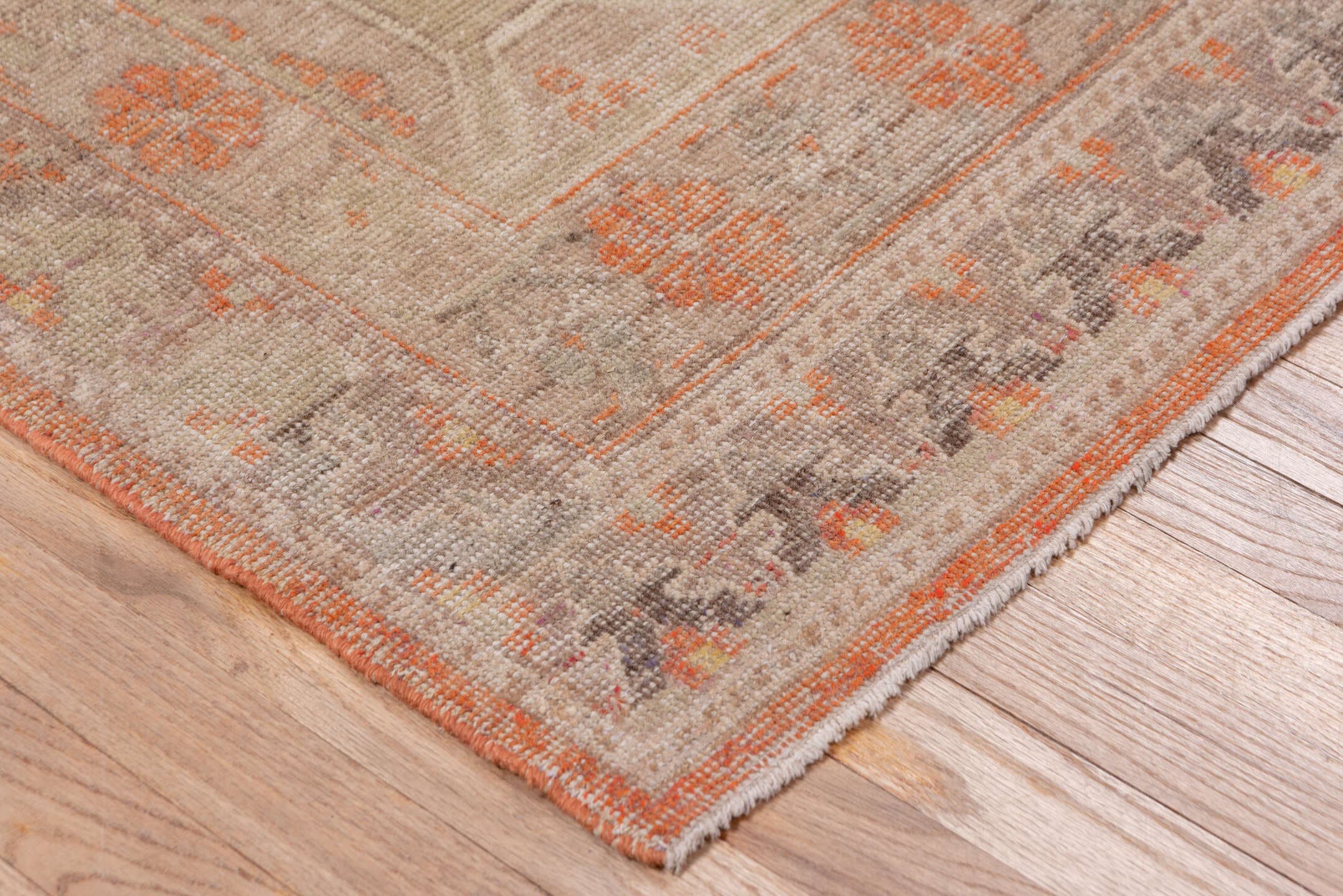 4' x 7' one-of-a-kind handmade antique Khotan rug. Color palette: taupe, coral, ivory, pewter, rose, camel, beige, gray