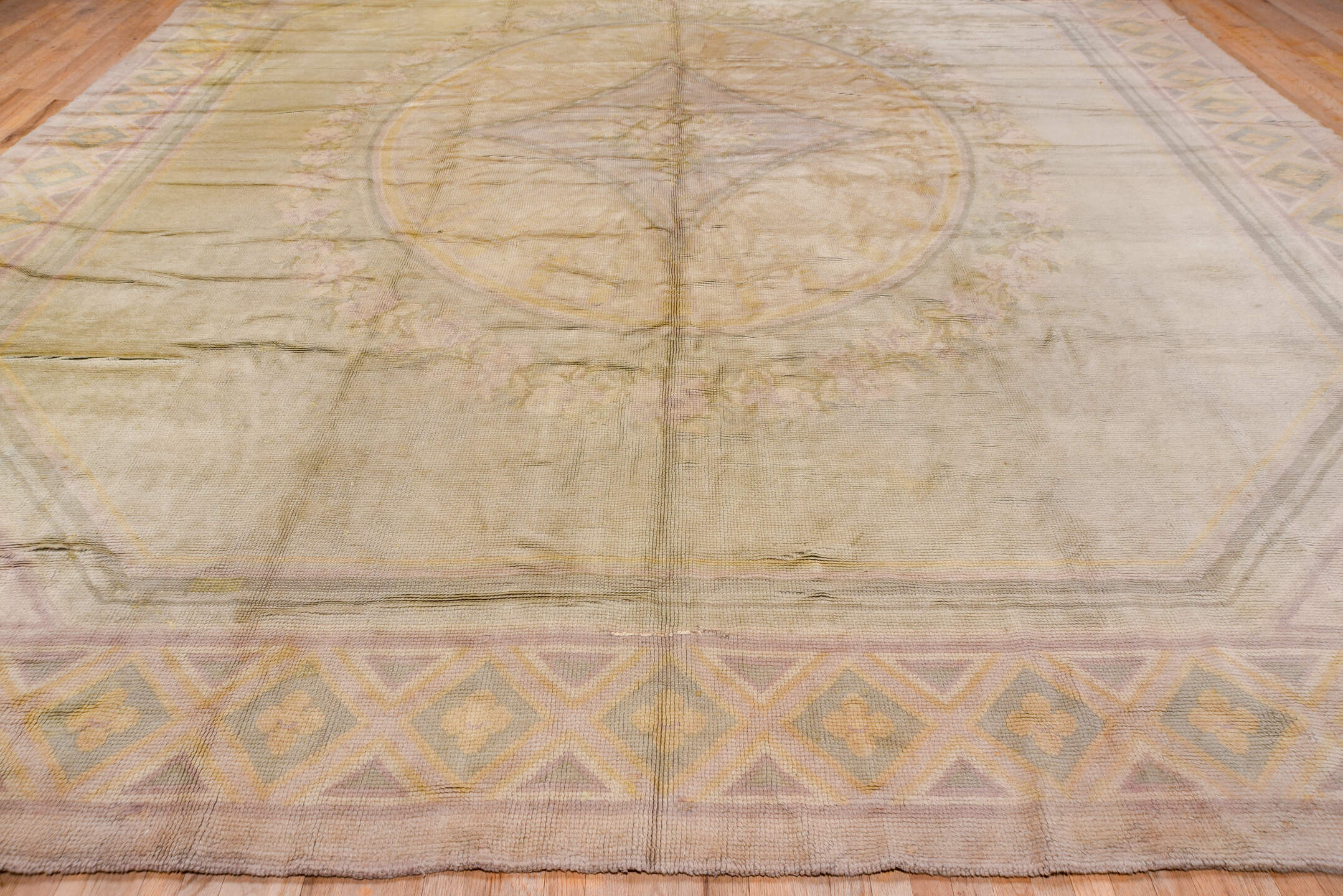 14' x 16' one-of-a-kind handmade vintage Savonnerie oversize rug. Color palette: ivory, blush, taupe, gold, sage, rose