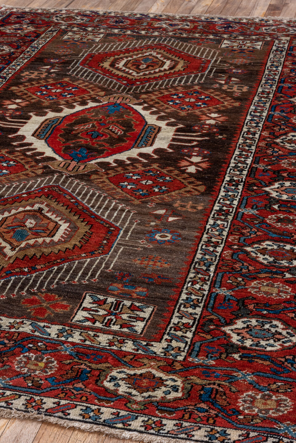 5' x 6' one-of-a-kind handmade antique Karaje rug. Color palette: rust, brown, ivory, indigo, navy, camel, crimson, taupe