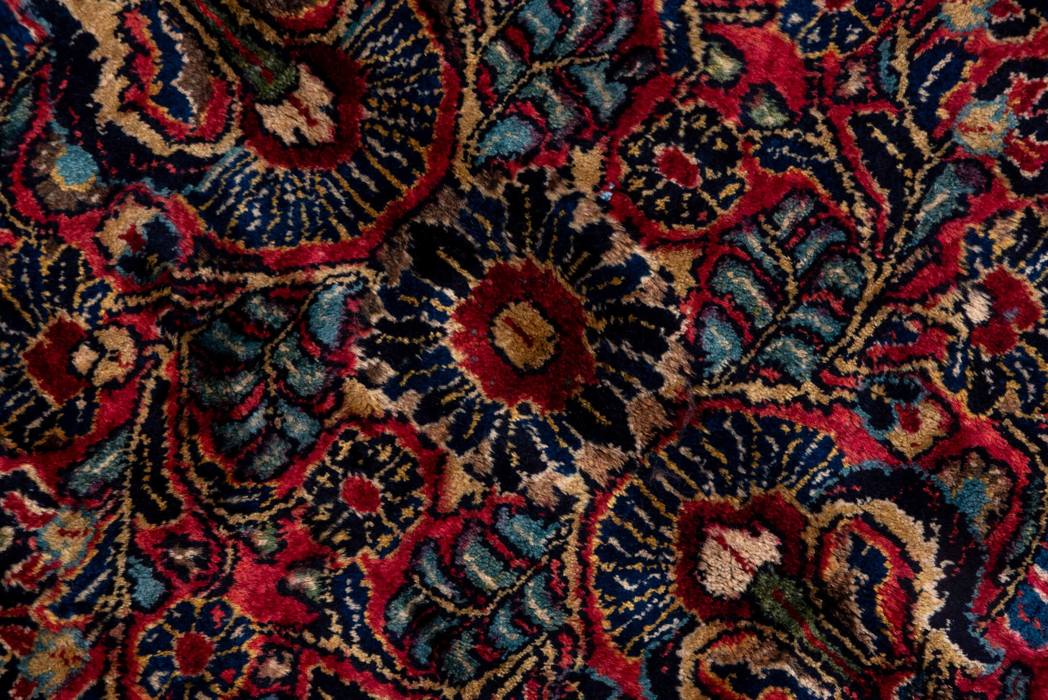 10' x 22' one-of-a-kind handmade vintage Sarouk rug. Color palette: black, blue, brown, burgundy, gray, pink, red
