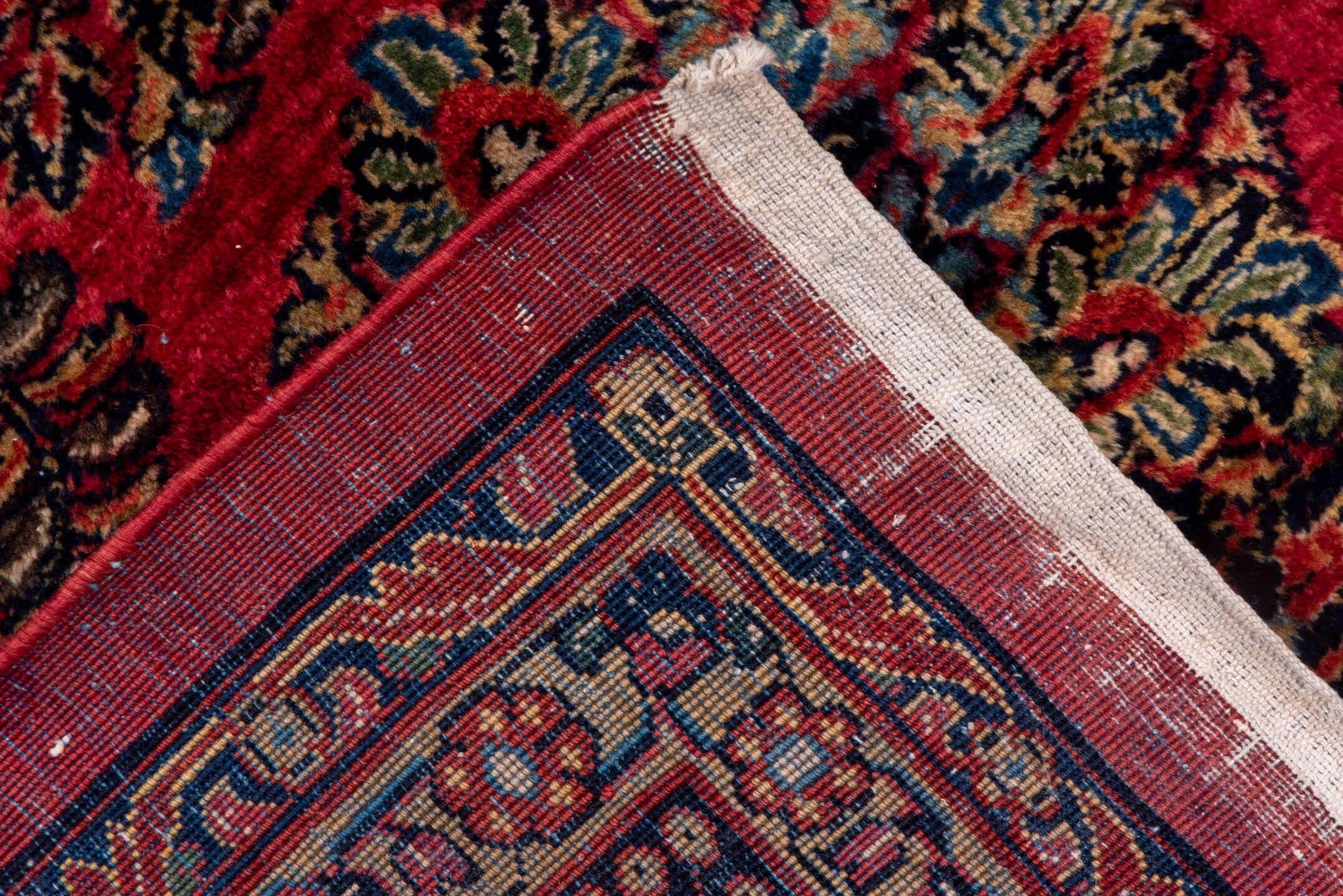 10' x 22' one-of-a-kind handmade vintage Sarouk rug. Color palette: black, blue, brown, burgundy, gray, pink, red